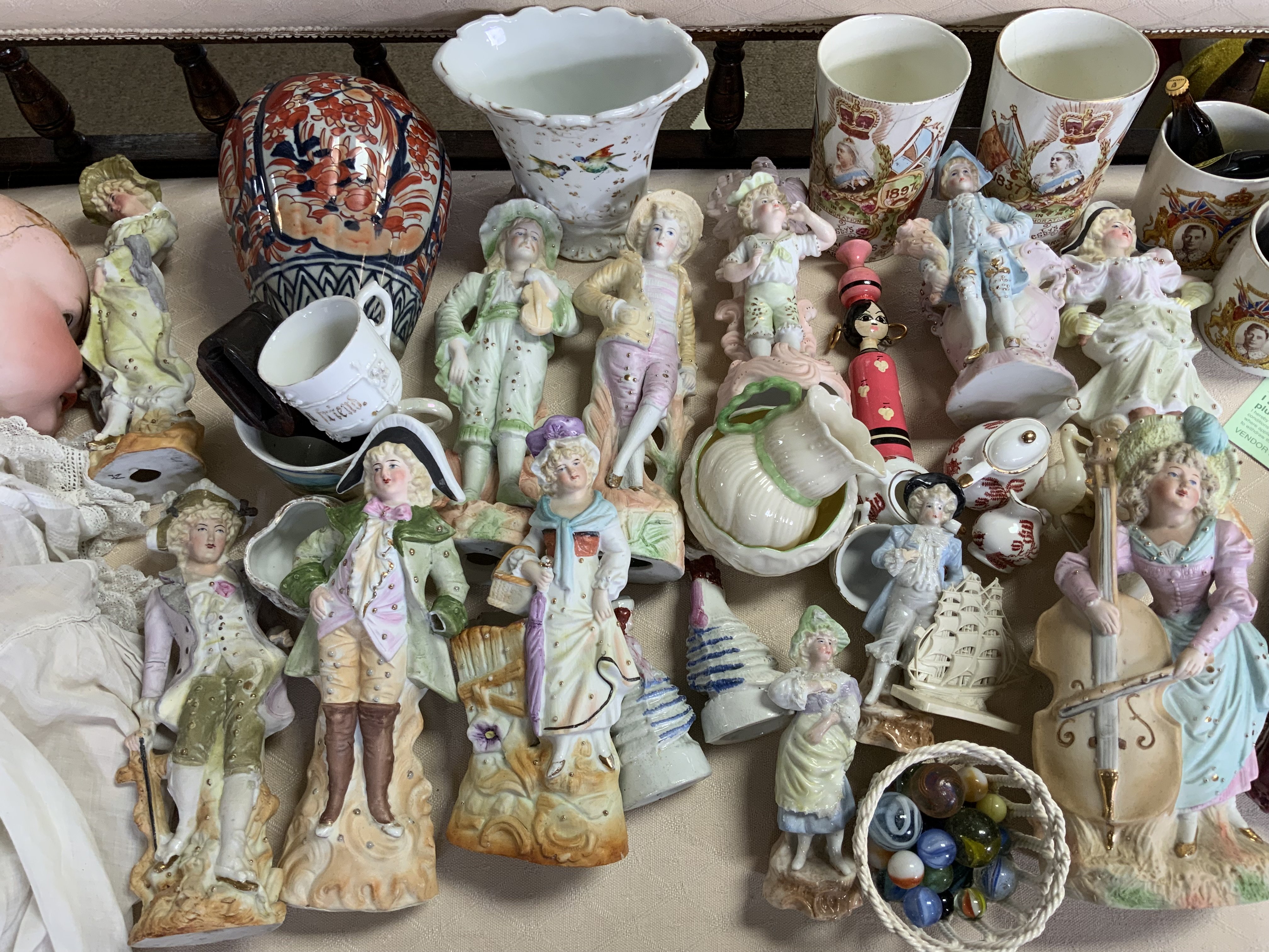 A large collection of Victorian and Edwardian bisque and pottery figures and other ceramics.
