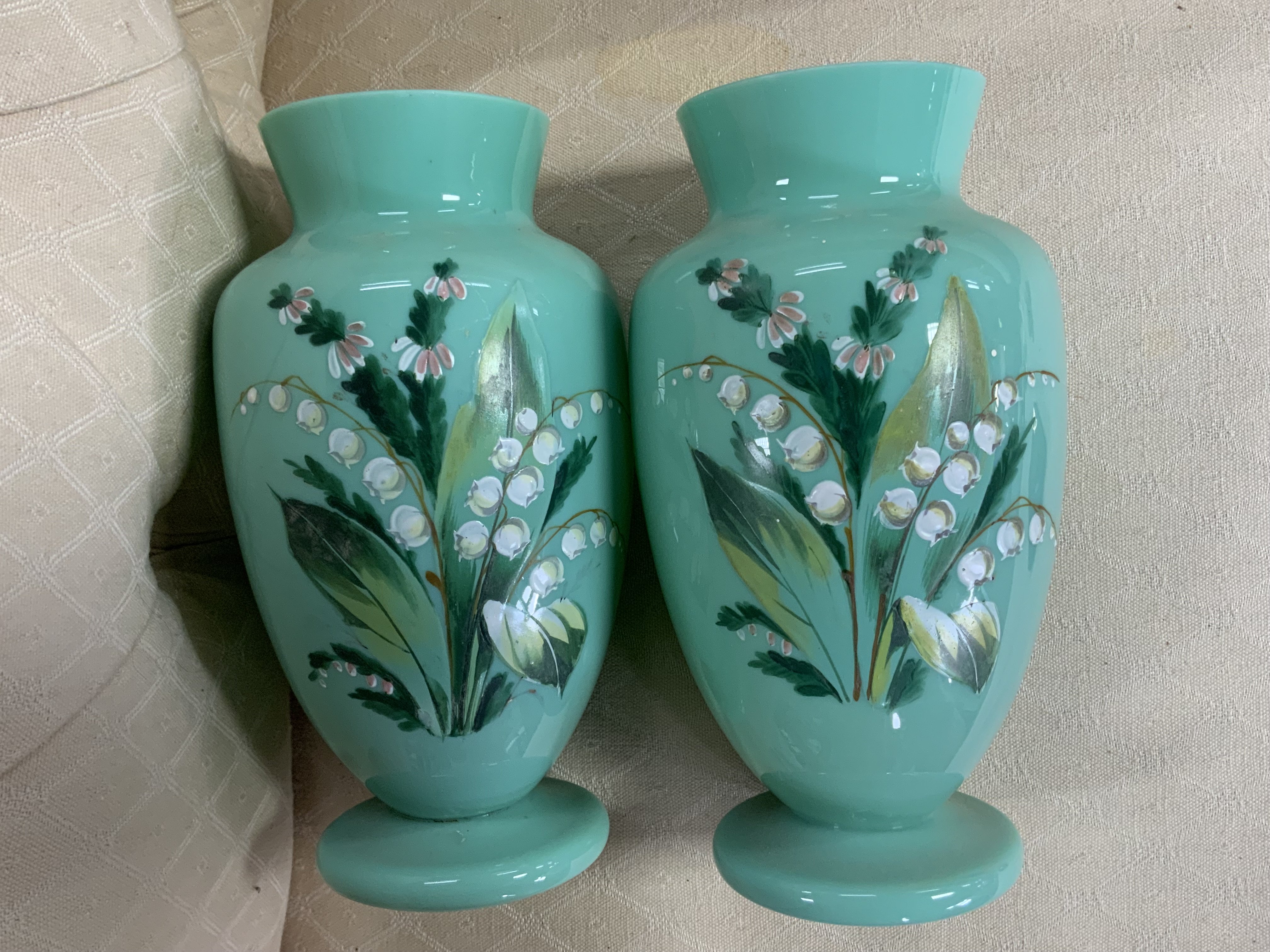 A pair of Victorian opaline glasses vases with enamel decoration.