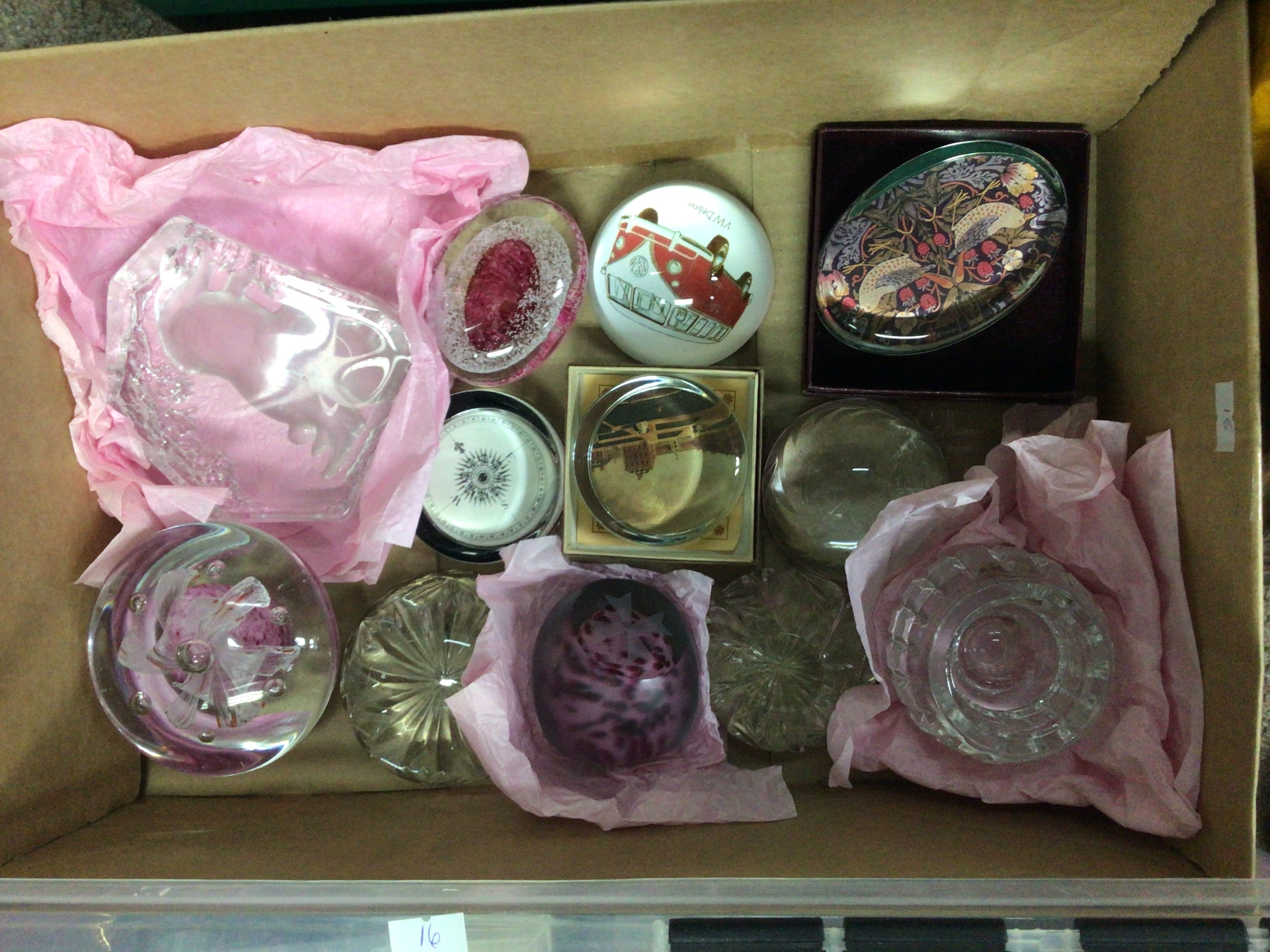 A collection of paperweights, including Scottish medina and past time examples.
