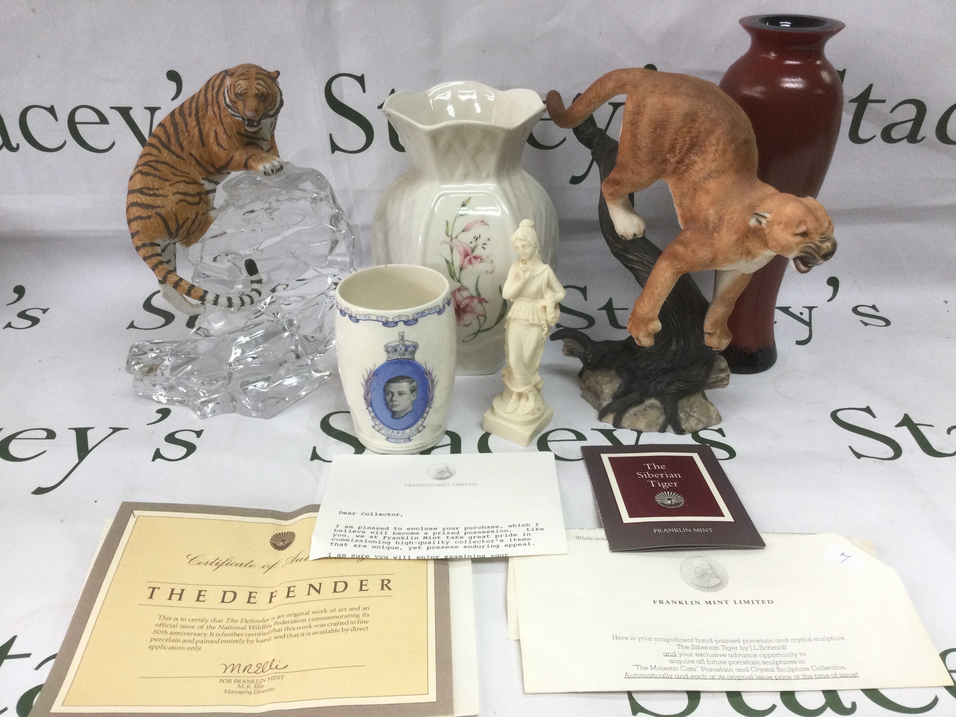 A small collection of china and glassware including two Franklin Mint figures of big cats, vases etc. Shipping category D.
