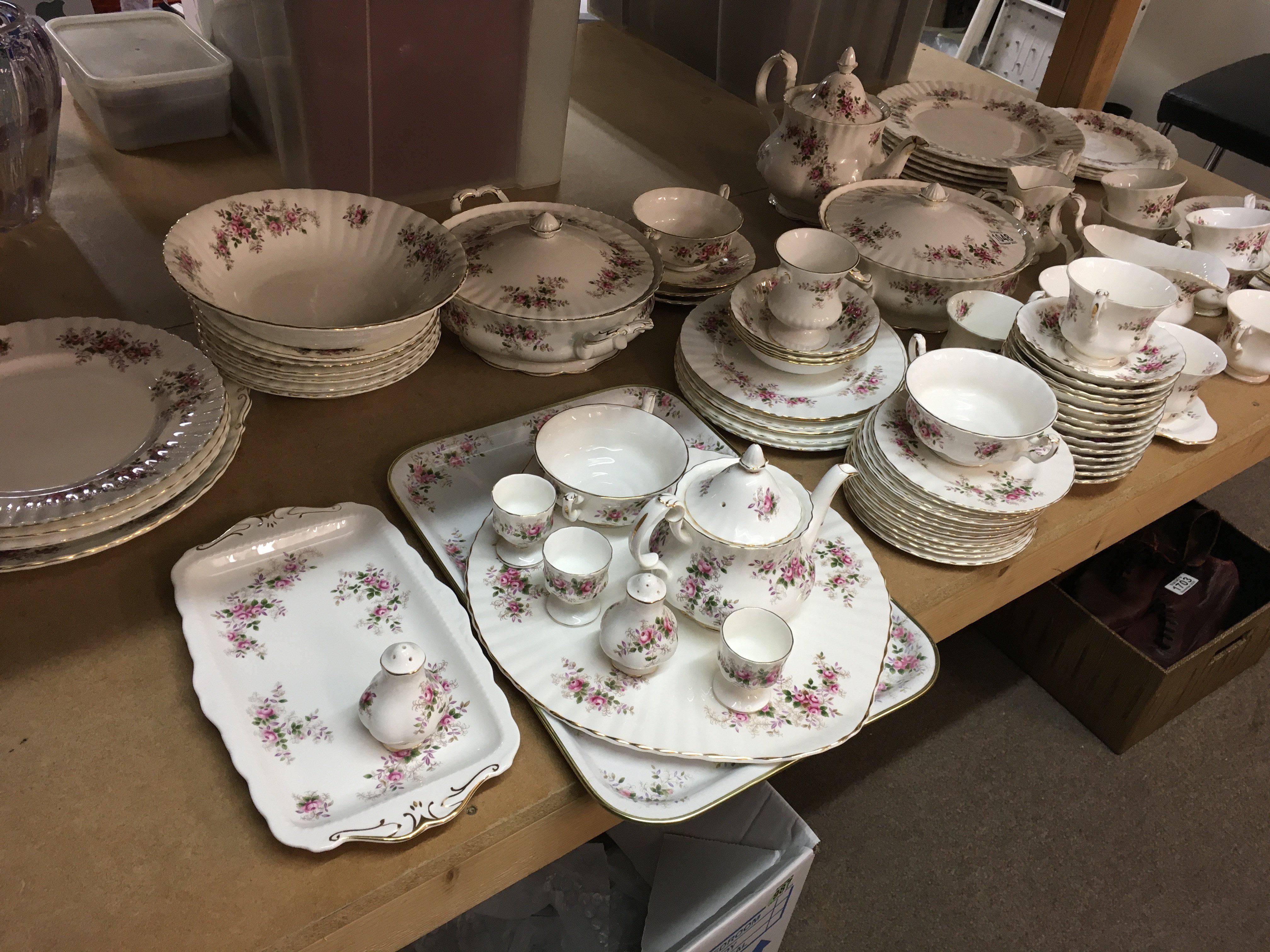 A Royal Albert Lavender rose dinner tea set including tea cups saucers dinner plates serving plates tureens serving plates and bowls .