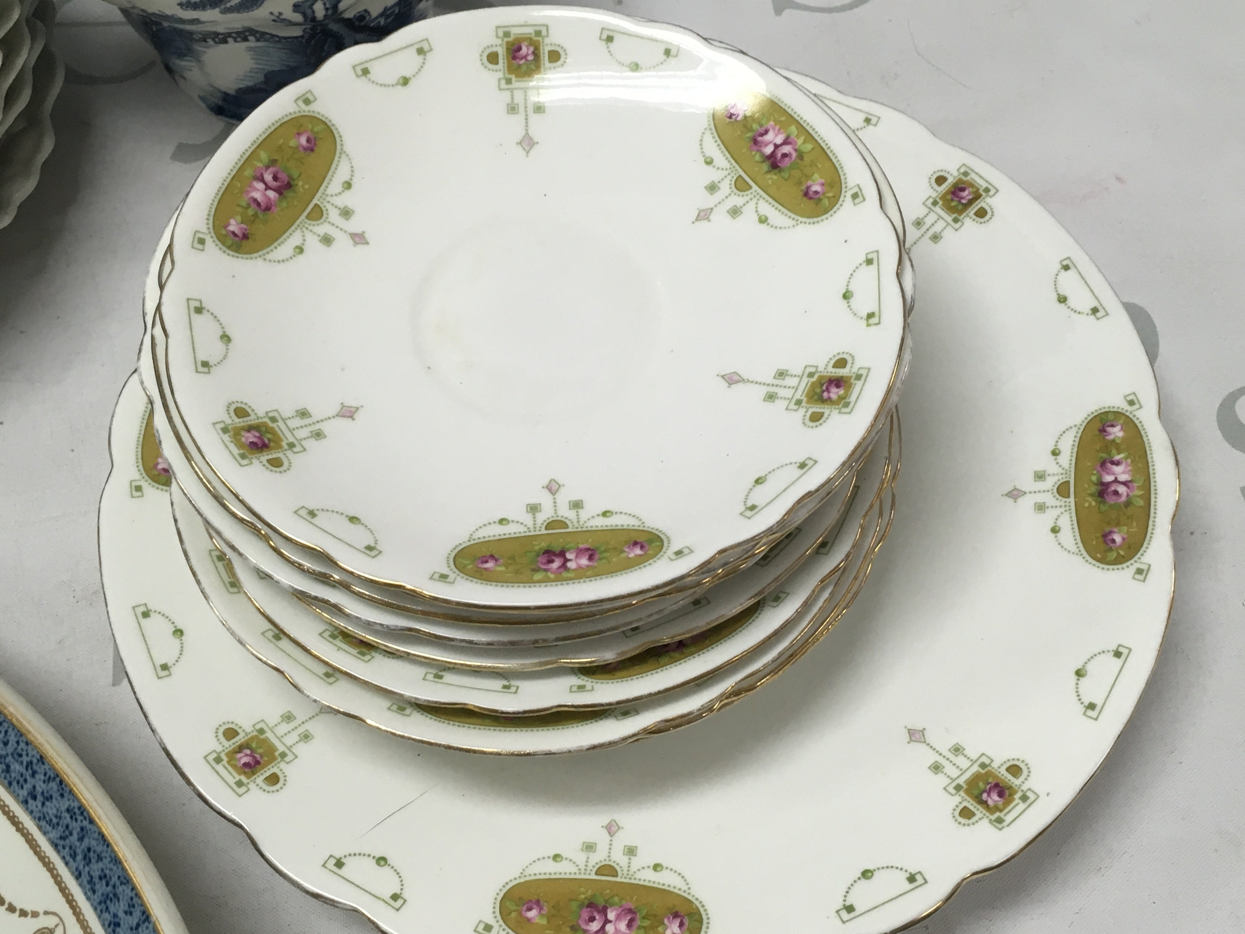 A Collection of ceramics including Alfred B Pearce plates and a platter, Late Foley Shelley Rose saucers, cup, plates, German plates with various designs, Booths jug . This lot cannot be posted. NO RESERVE