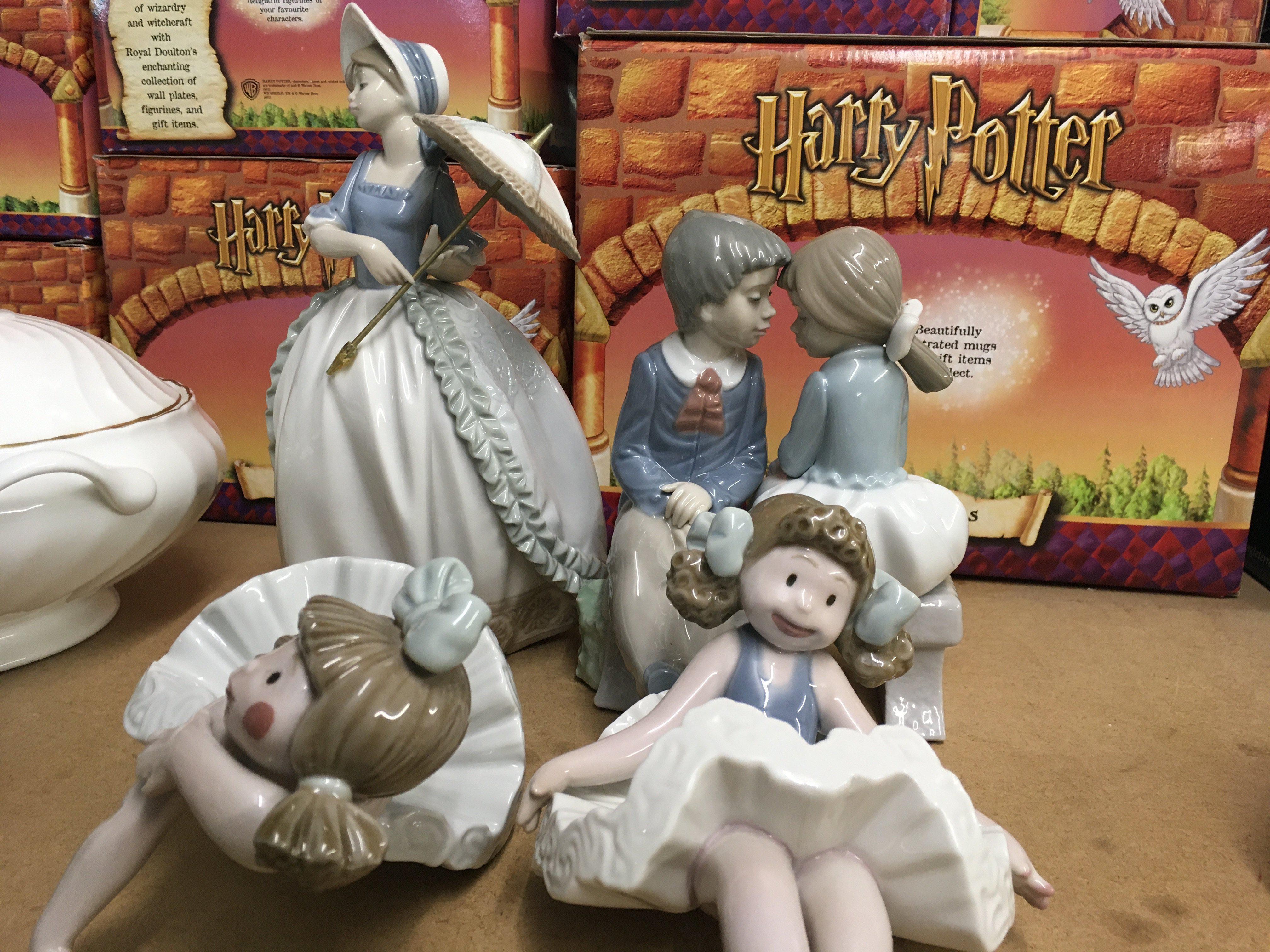 A Collection of four figures two Nao two Lladro.