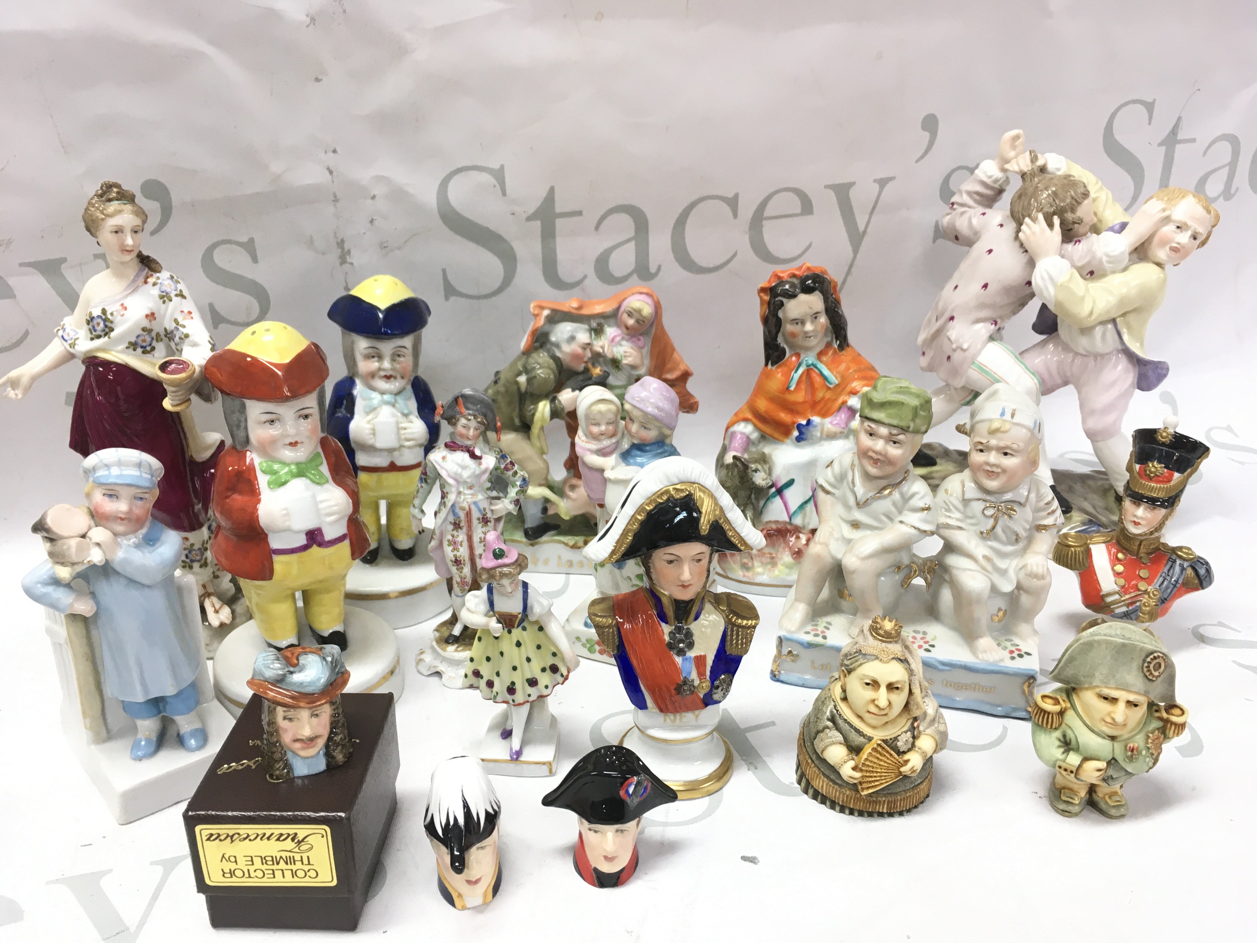 A collection of classical porcelain figures including German examples, pot-belly caricatures of Queen Victoria and Napoleon Bonaparte, Staffordshire figures etc. this lot cannot be posted