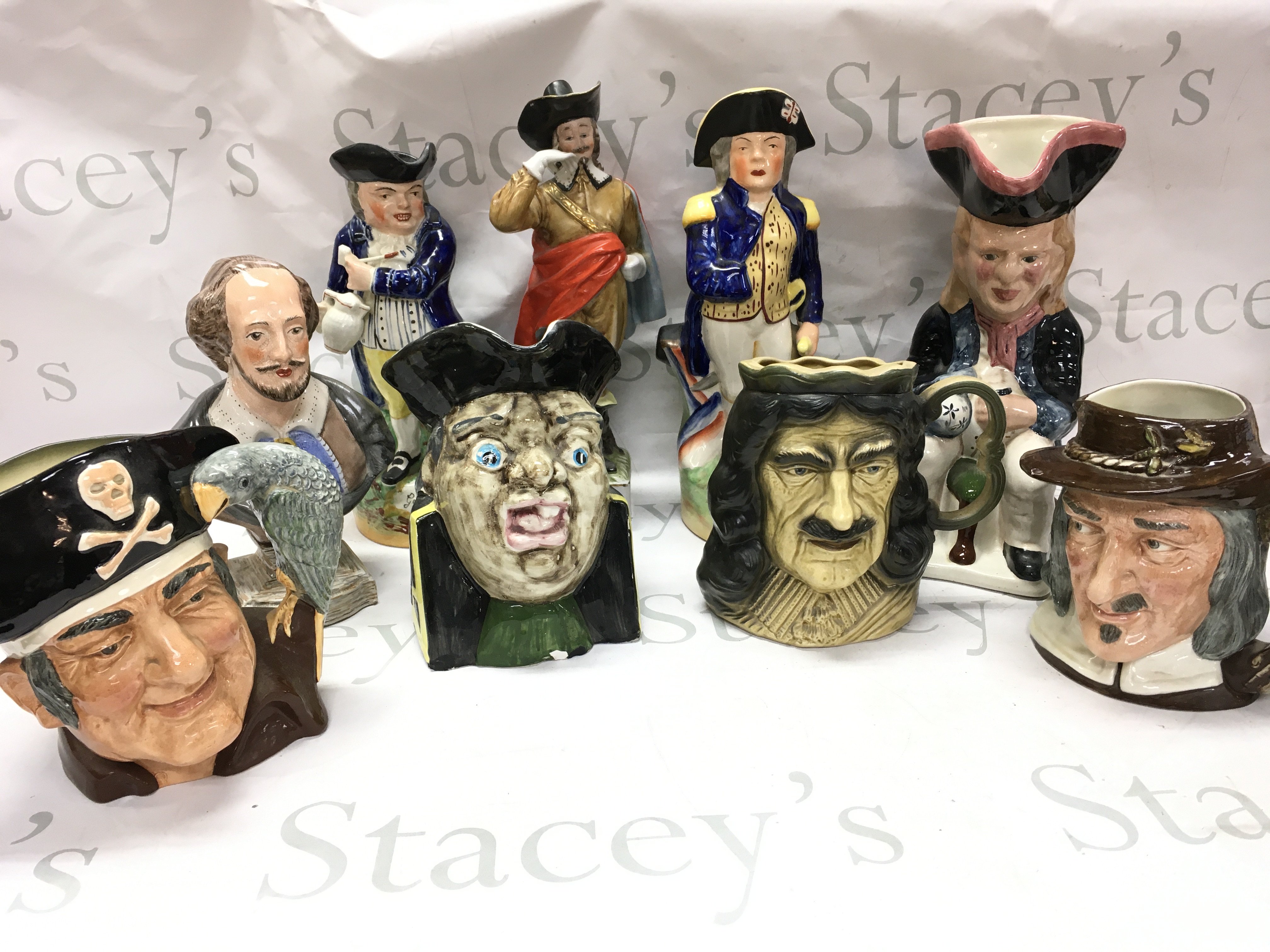 A collection of ceramic character jugs including Buccaneer by David Sharp , Royal Doulton Izaak Walton, Kingston pottery. This lot cannot be posted