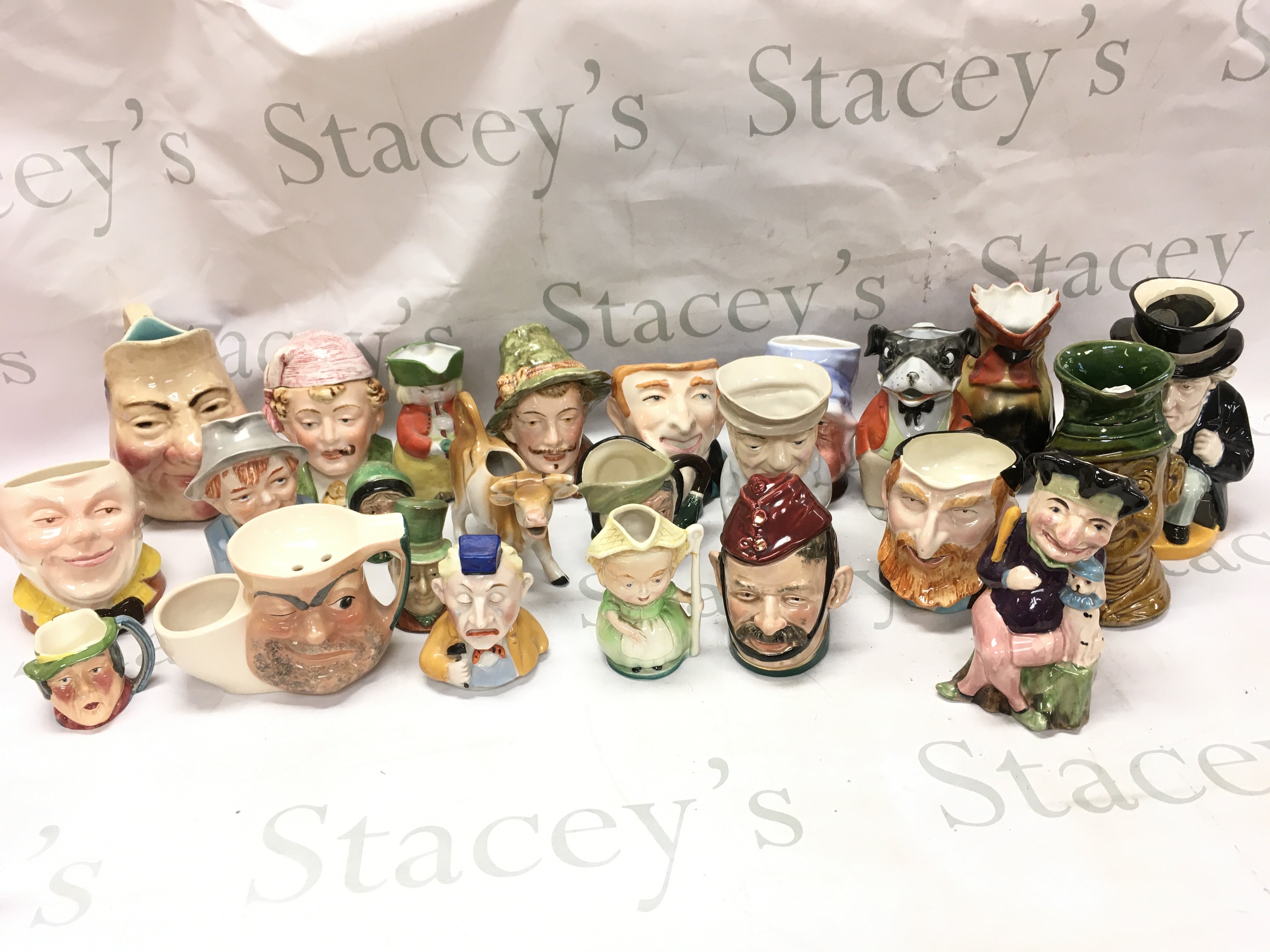 A collection of ceramic character jugs including Sarreguemines, Melba Ware, Sandyford etc. this lot cannot be posted