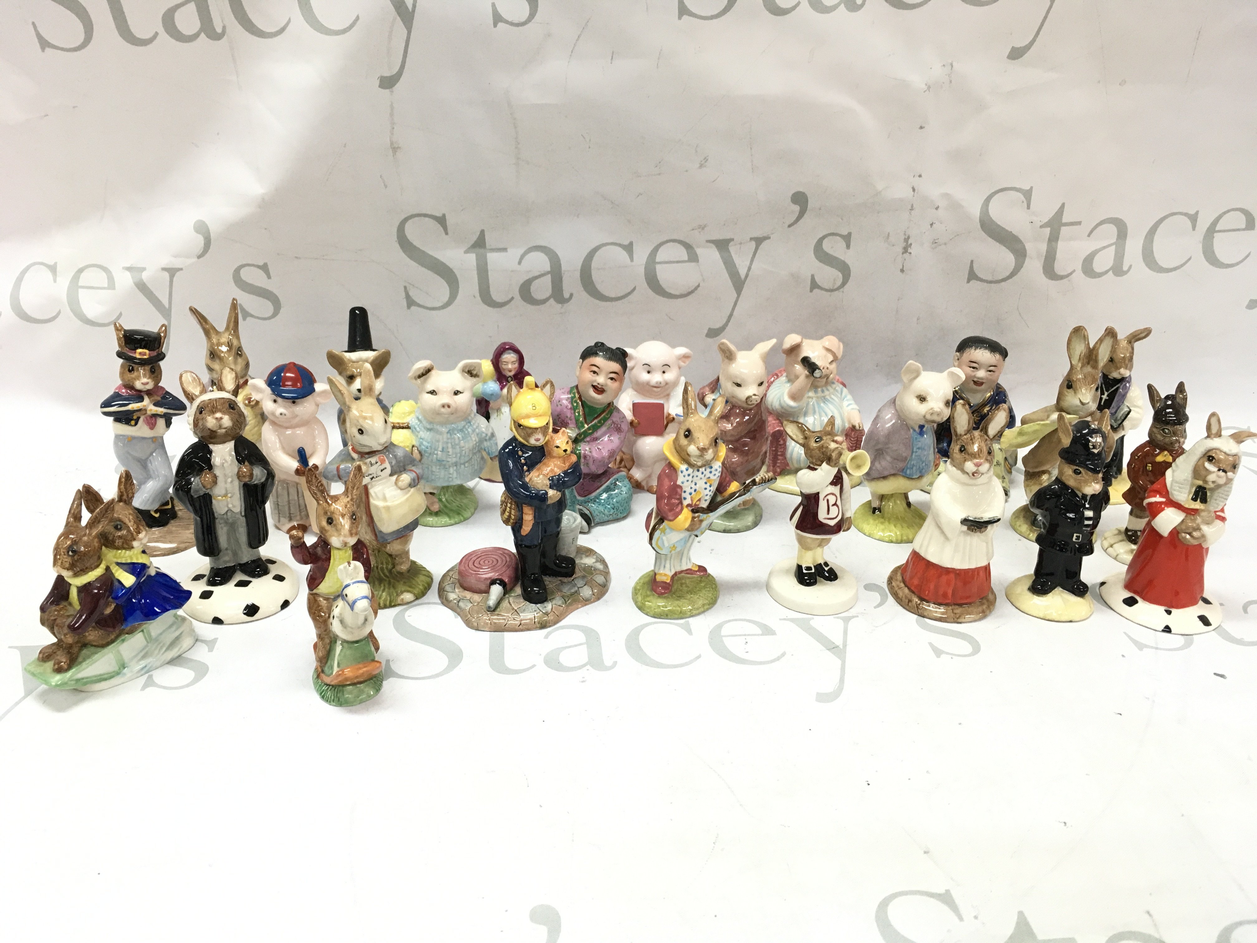 A collection of porcelain figures including Royal Doulton Bunnykins, Royal Albert Beatrix Potter . This lot cannot be posted