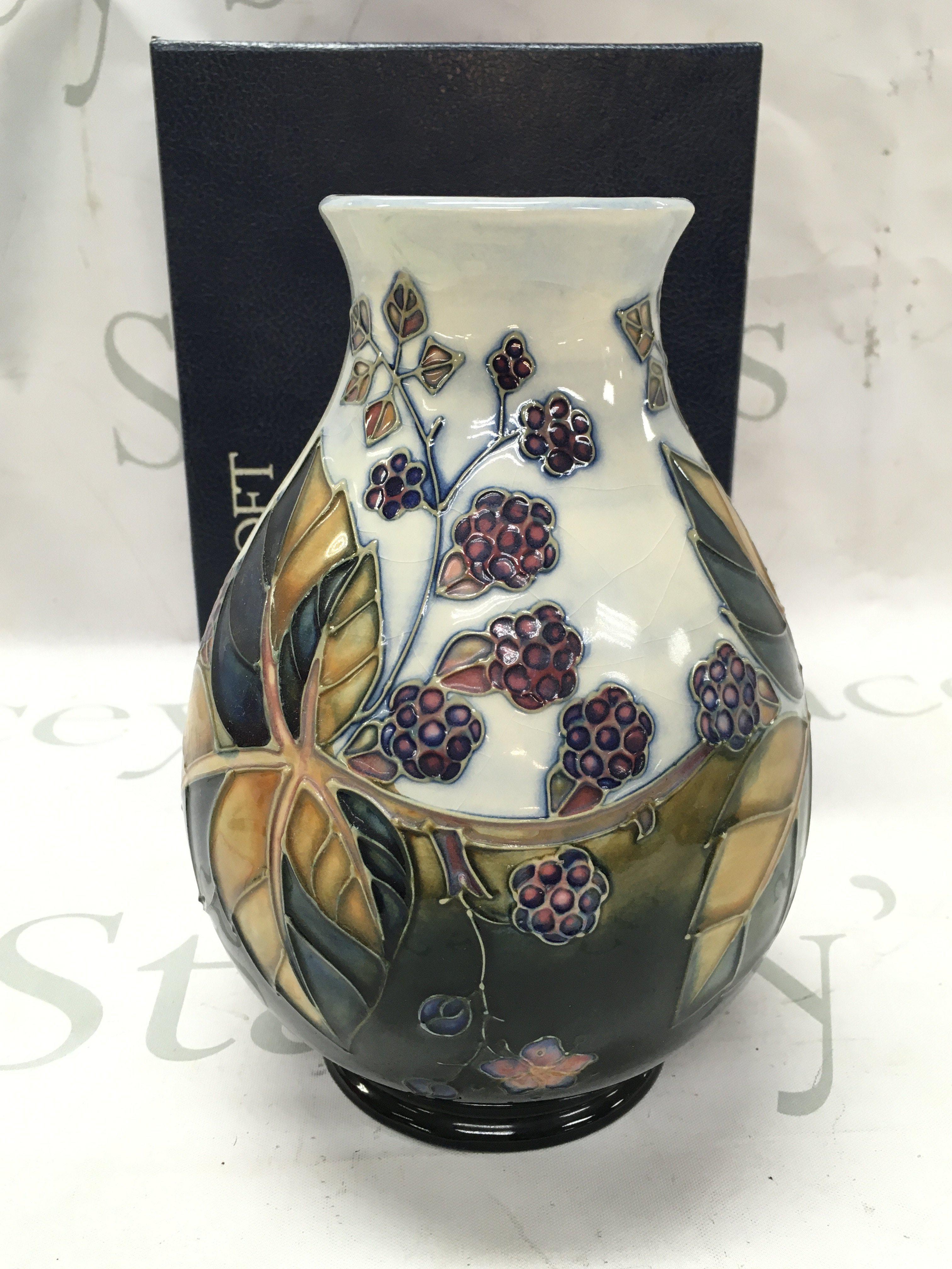 A boxed Moorcroft bramble vase , 19cm tall. This lot cannot be posted