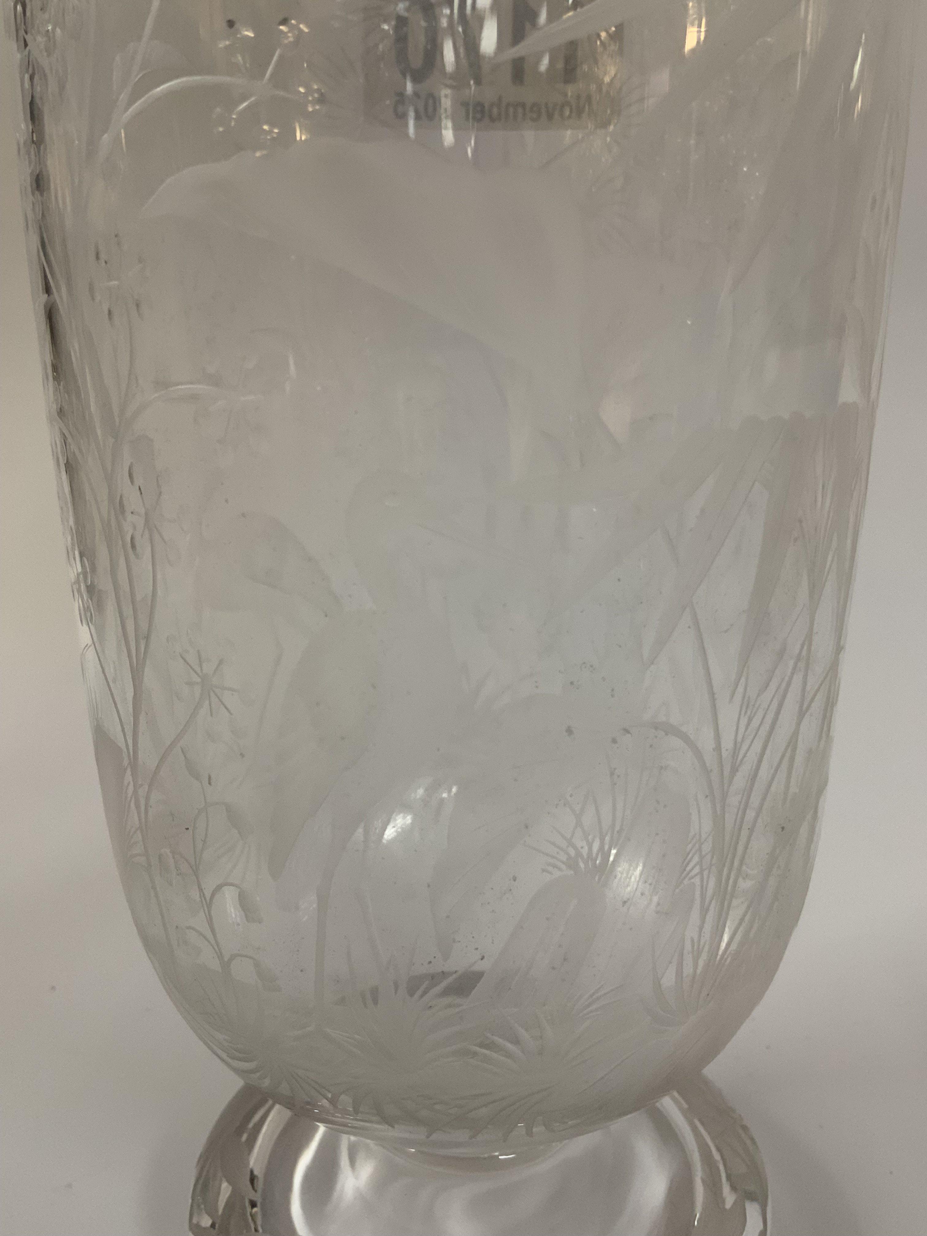 A fine etched glass decanter with views of storks amongst reeds, 28cm (no stopper)