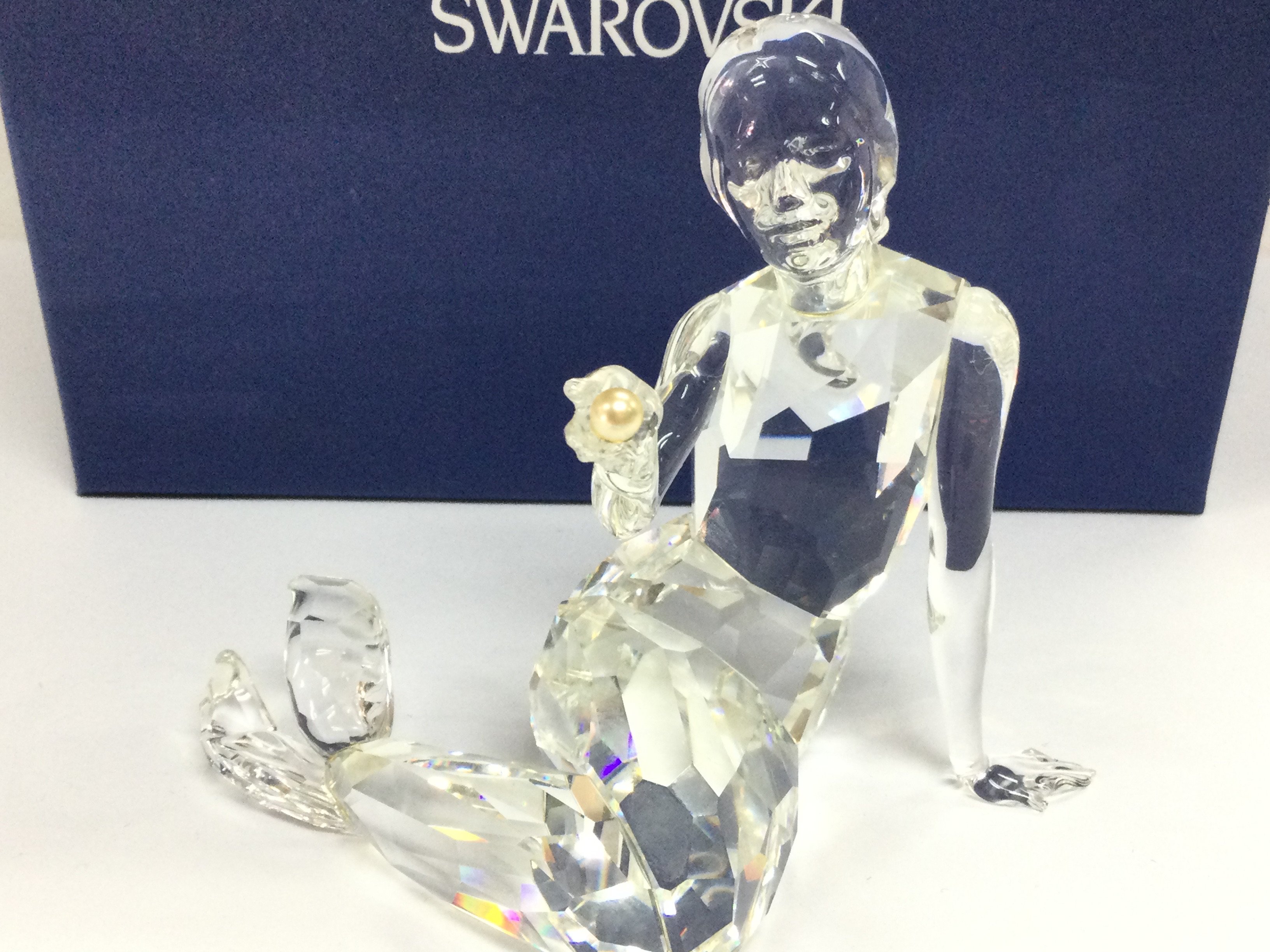 A boxed Swarovski Crystal glass Mermaid with pearl figure . This lot cannot be posted- NO RESERVE