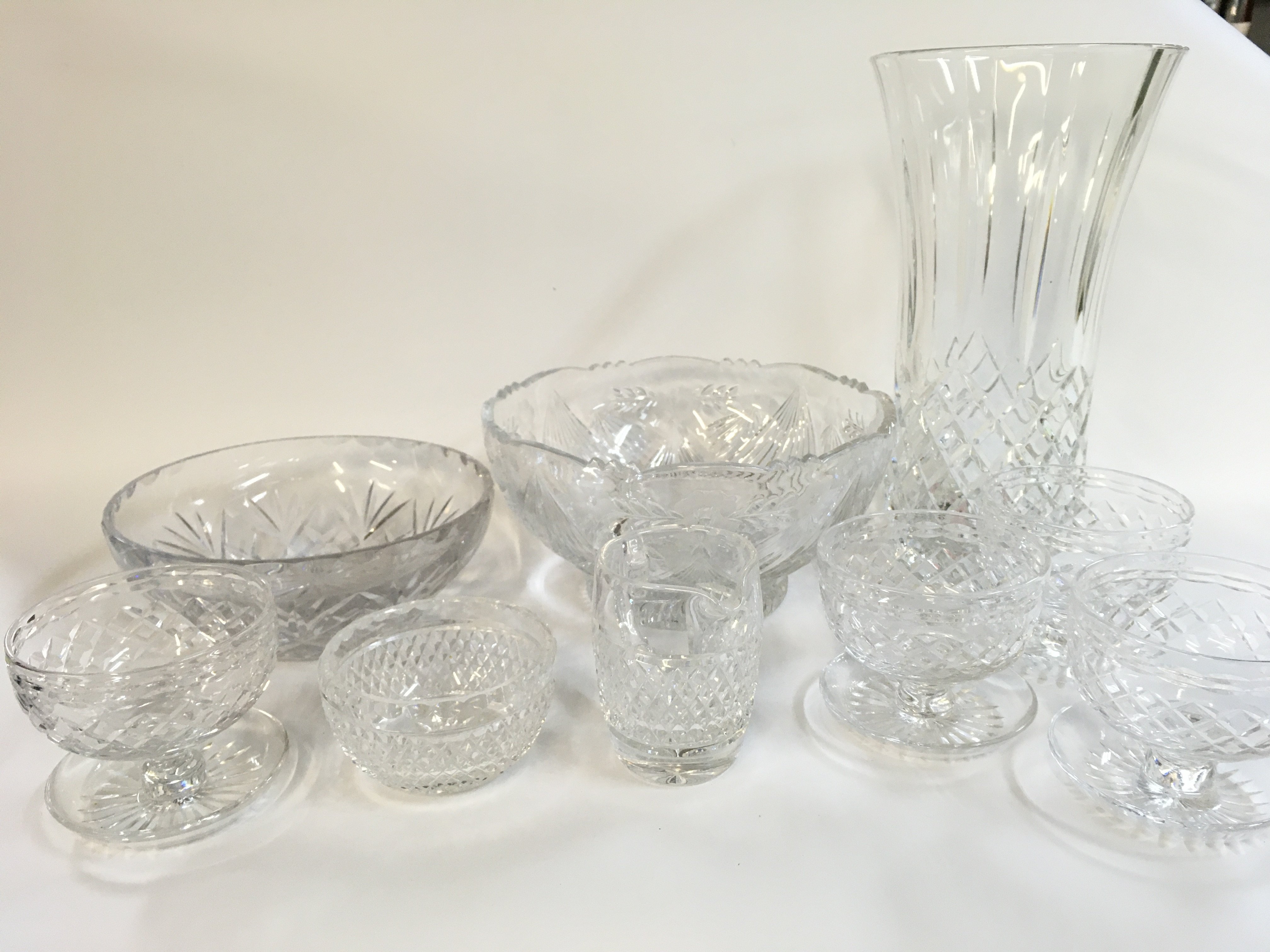 A Collection of lead crystal glass including a vase, bowls etc . This lot cannot be posted