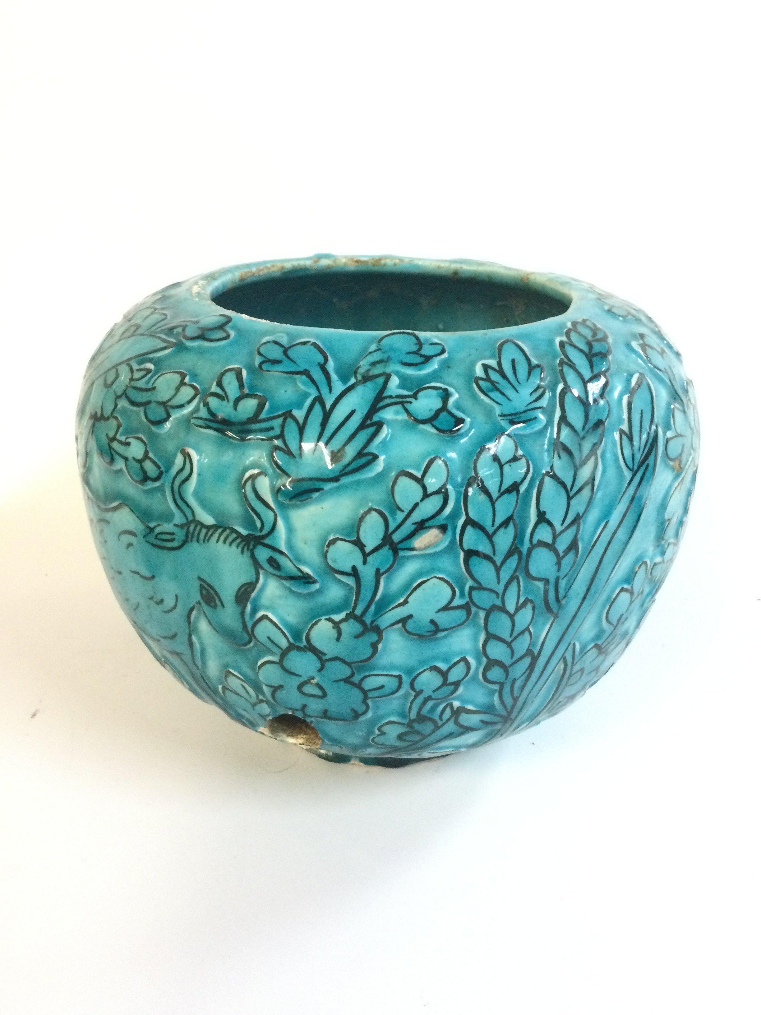 A large continental turquoise glazed pottery bowl with incised decorated , 17cm tall. no reserve