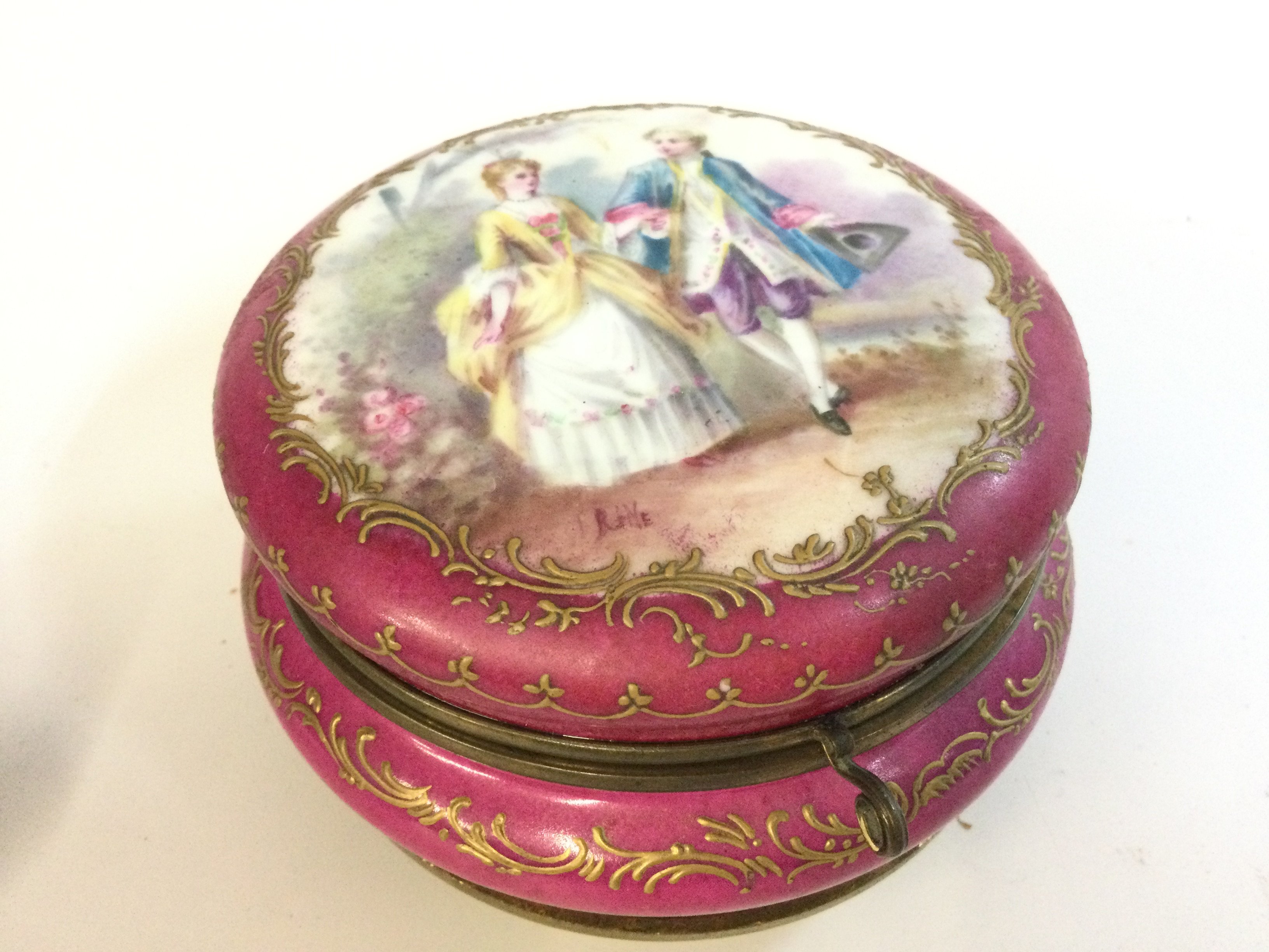 An Antique Sevres French jewellery trinket box signed by Rene and hallmarked for Sevres . 7.5cm tall.