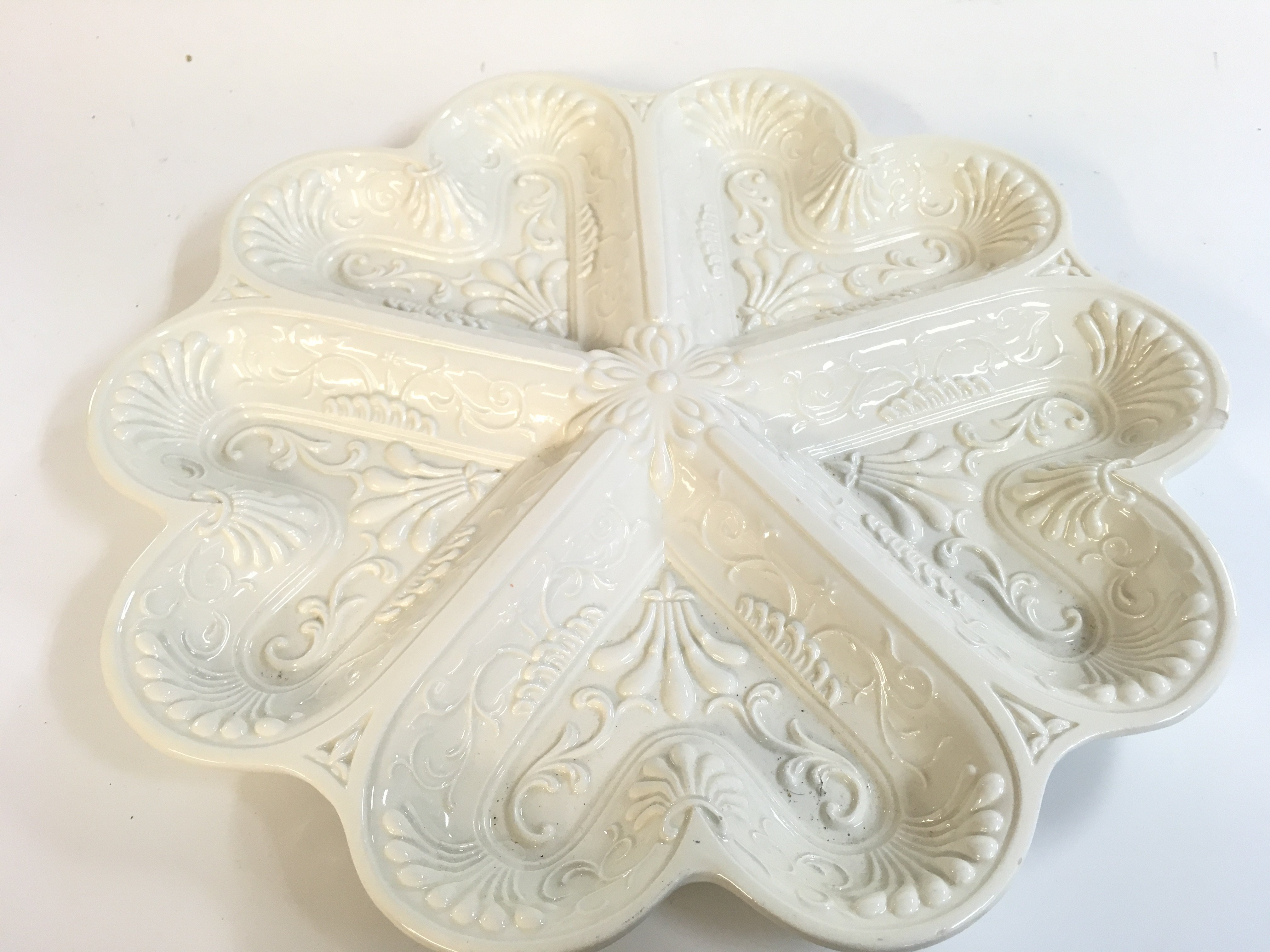 A decorative salt plate 32cm wide. No reserve