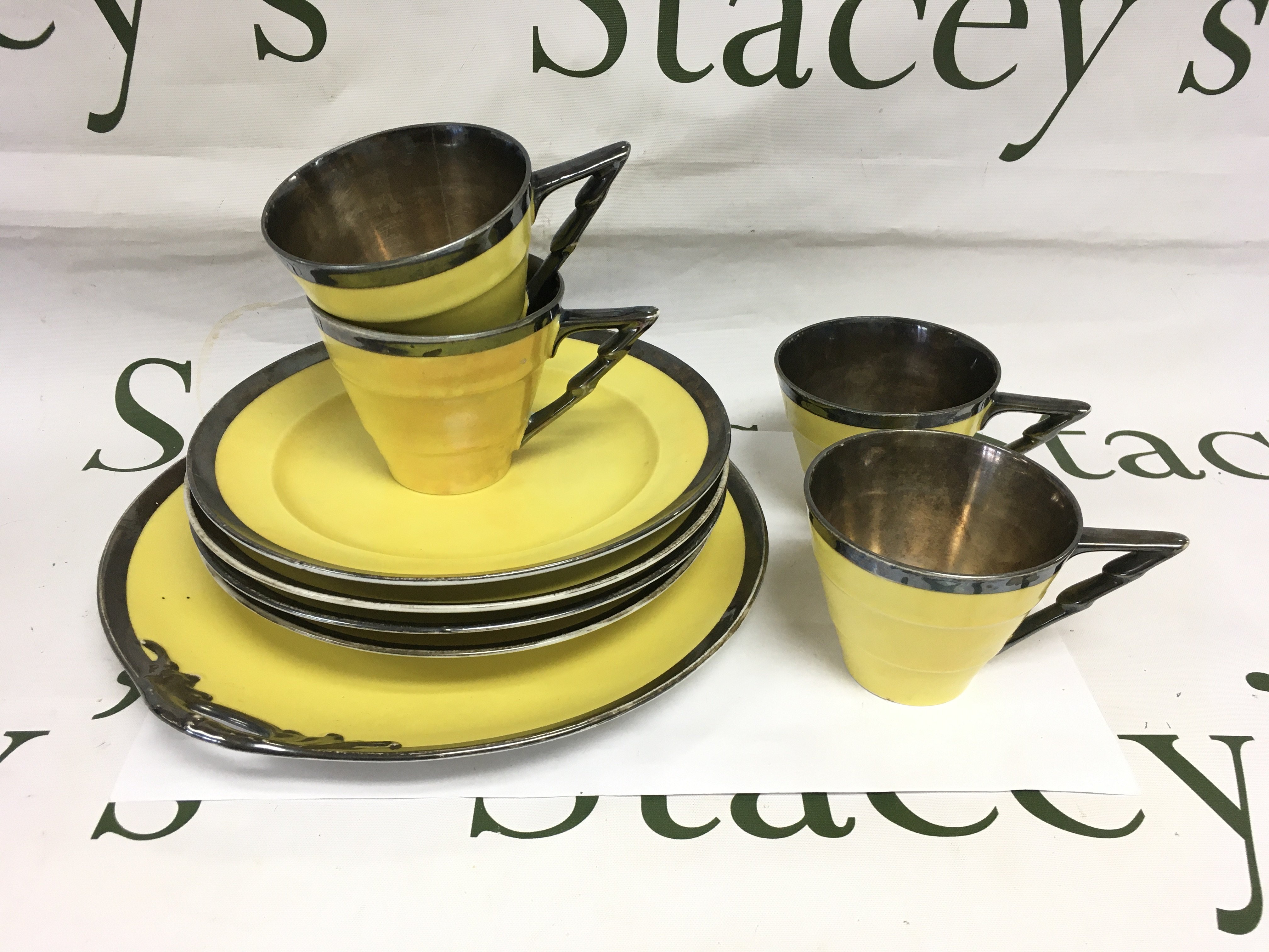 A four place setting sterling silver coated part tea set. Shipping category D.