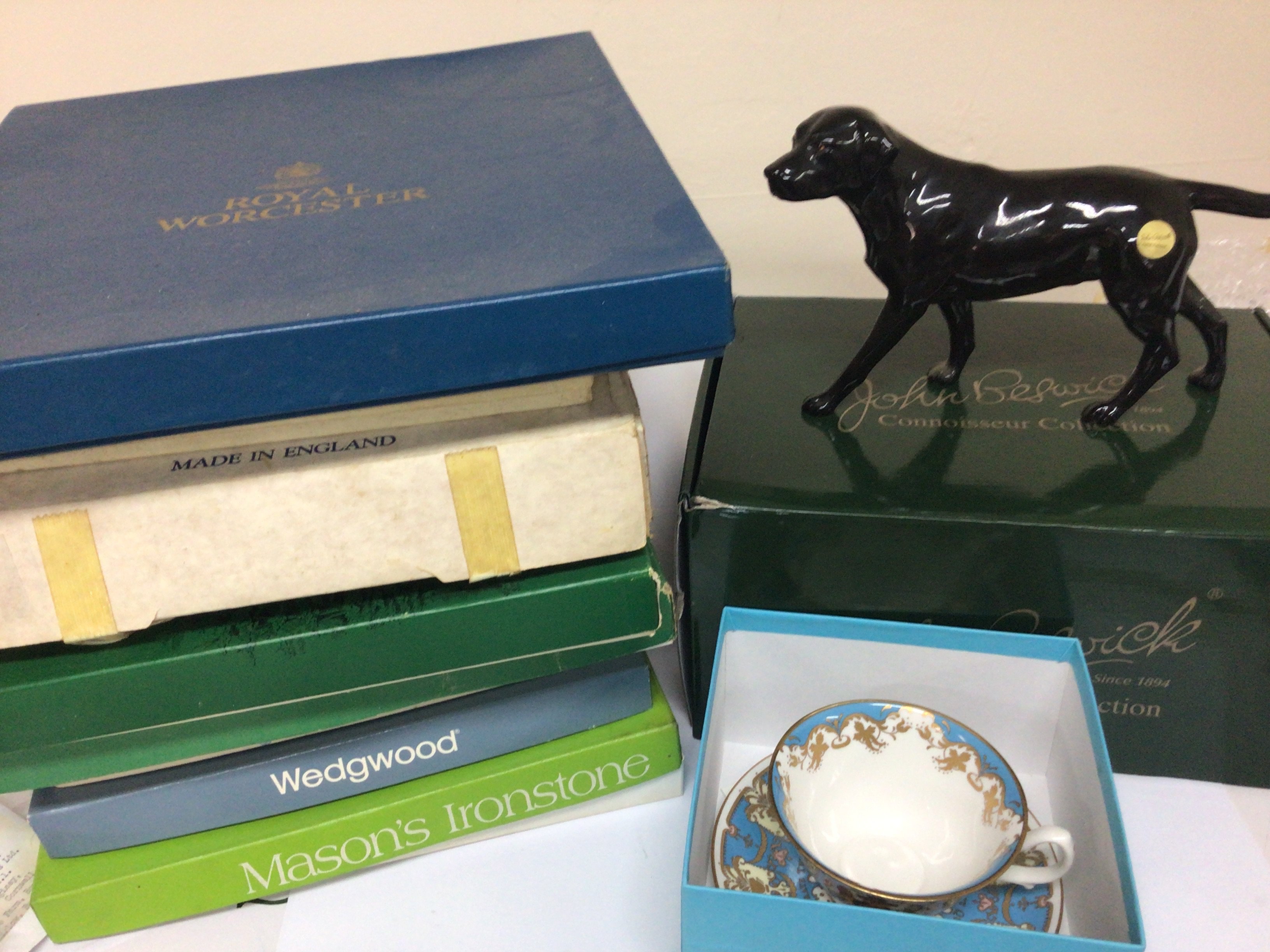 A Boxed Beswick Connoisseur model of a black Labrador dog. boxed Royal Collection cup and saucer Wedgwood and Masons collectors plates.
