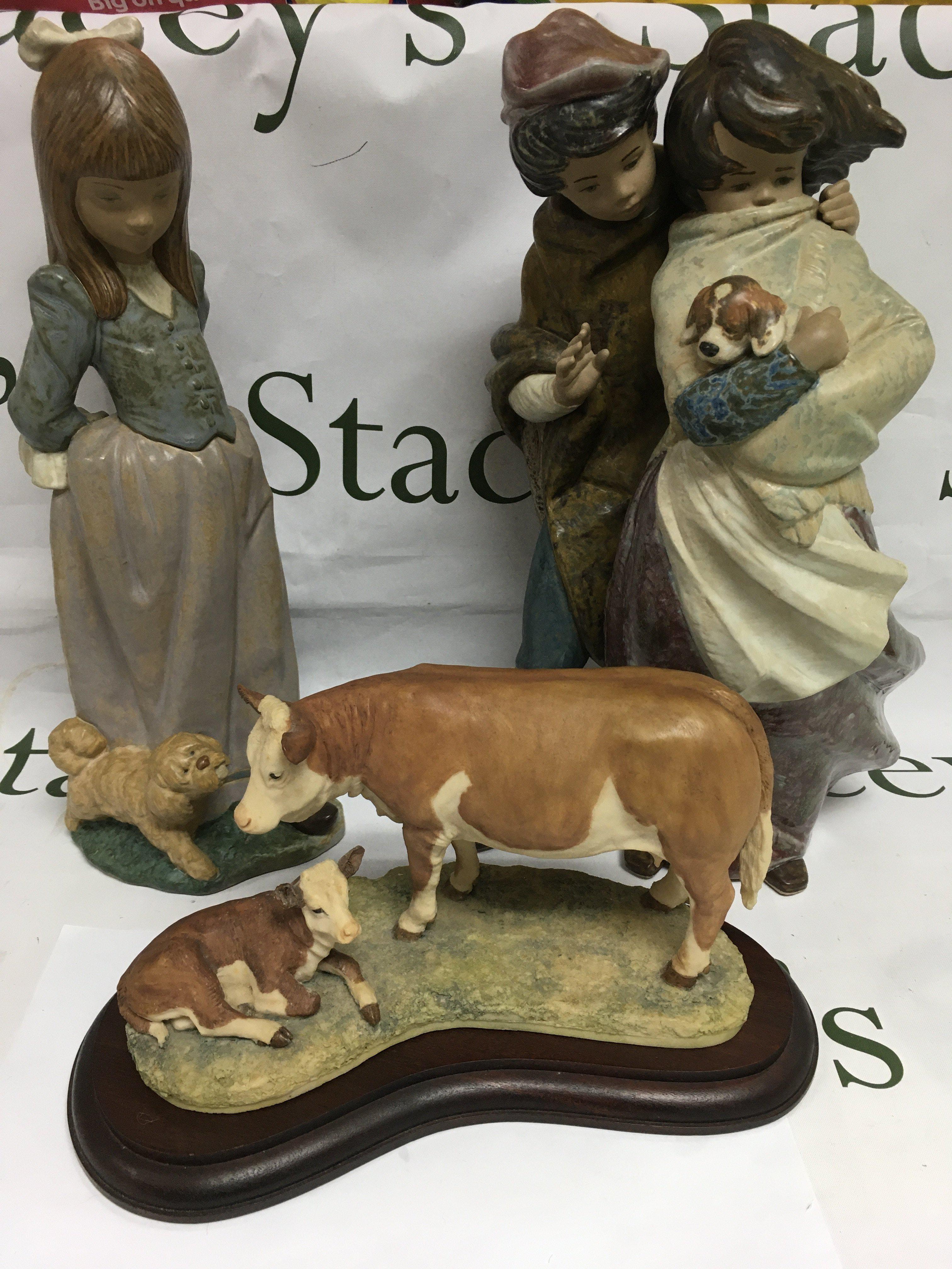 Two larger Lladro figures and a Border Fine Arts cow and calf on a wooden base. Largest figure approx 36.5cm. Shipping category D.