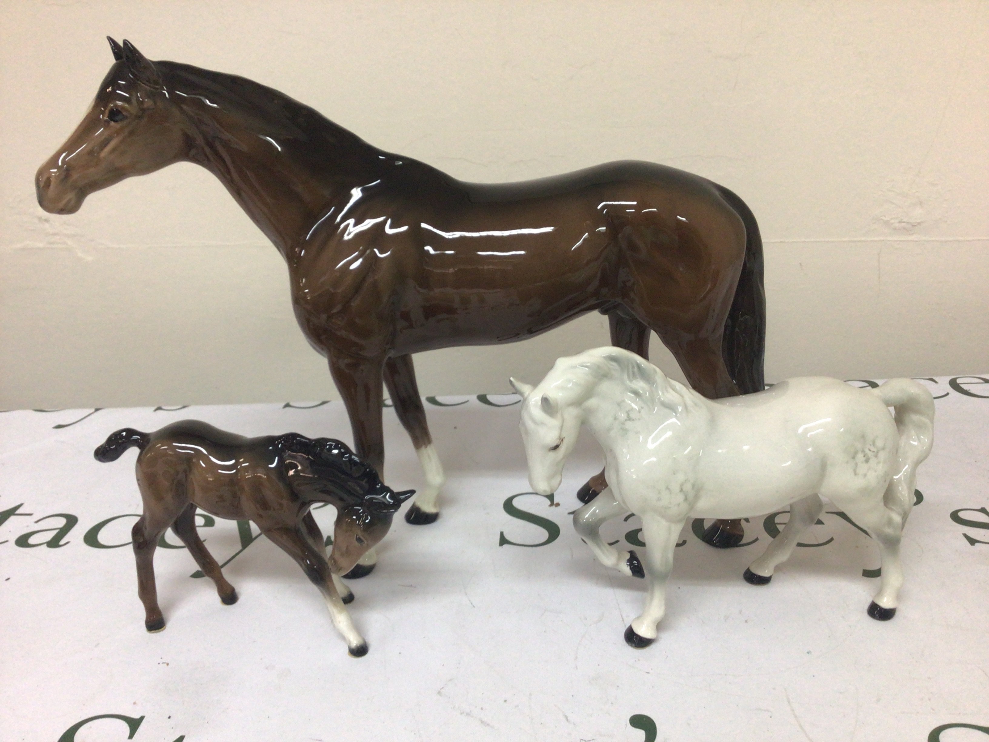 Three Beswick horses a large bay horse foal and a dapple grey pony no obvious damage (3)