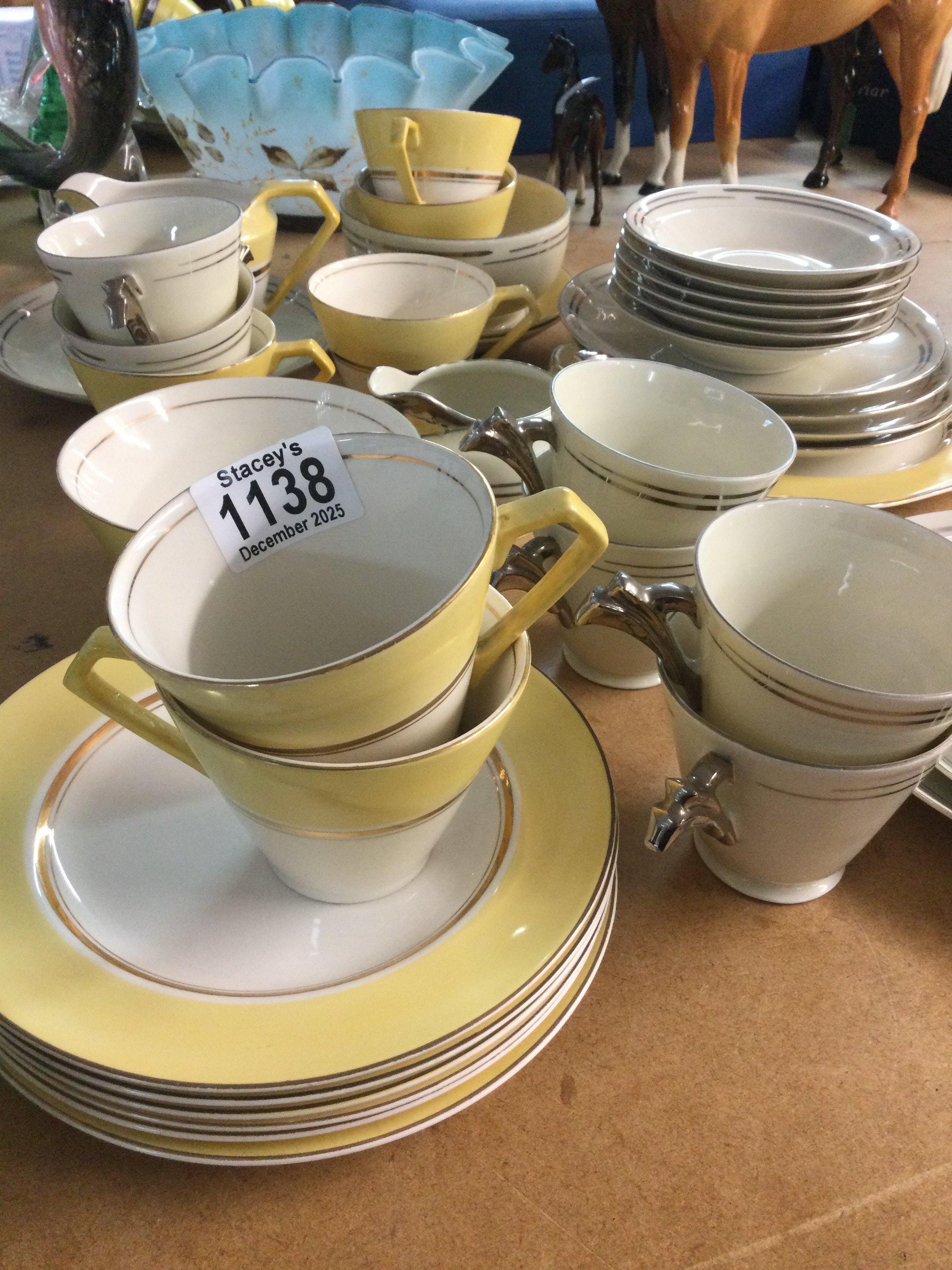 Two Art Deco style tea sets with silver banding