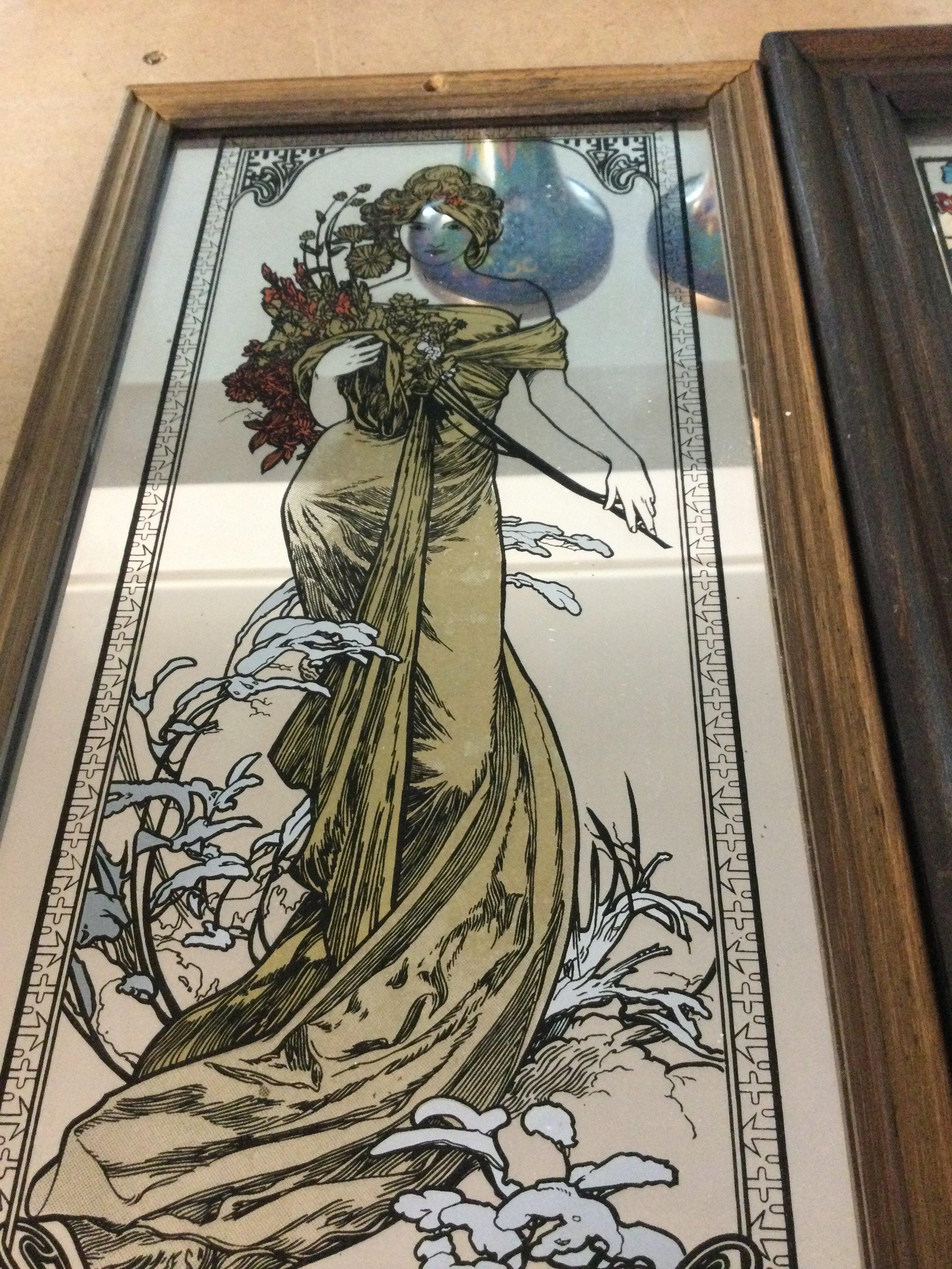 Four small framed mirrors with Art Nouveau design.