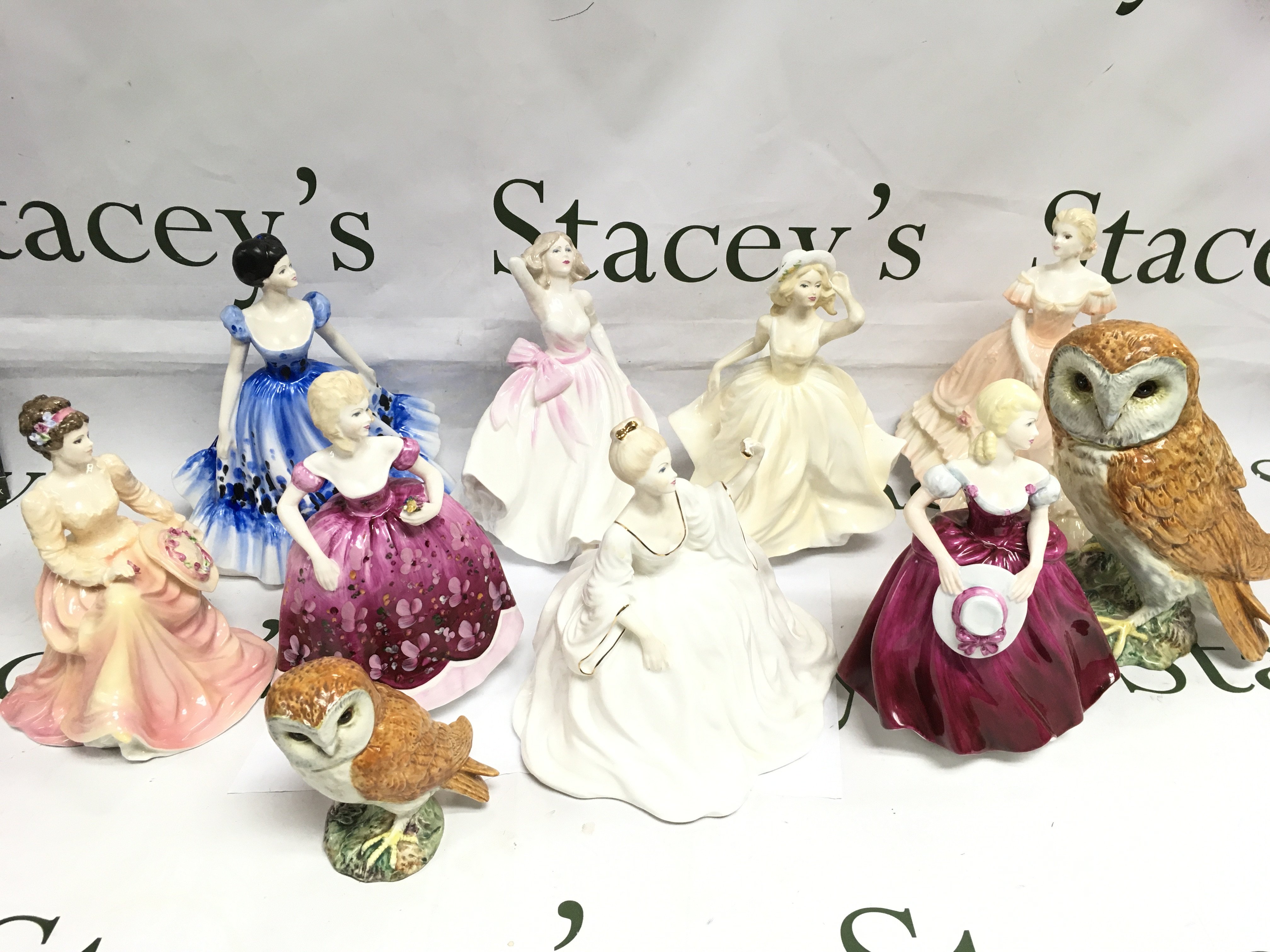 A collection of Coalport figures and two Beswick owls (10). Shipping category D.