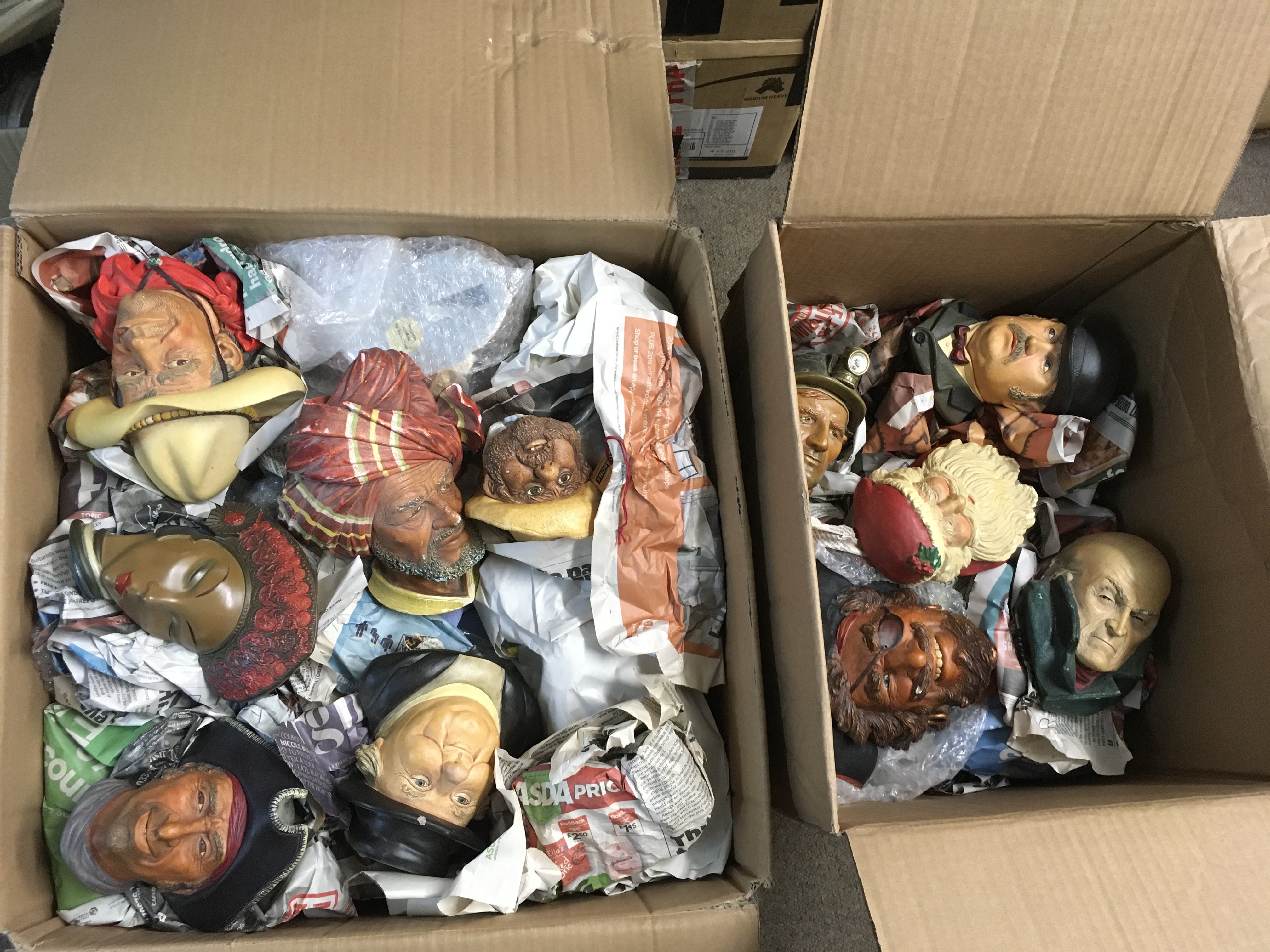 Two boxes of Bossons heads and wall plaques. Shipping category D.
