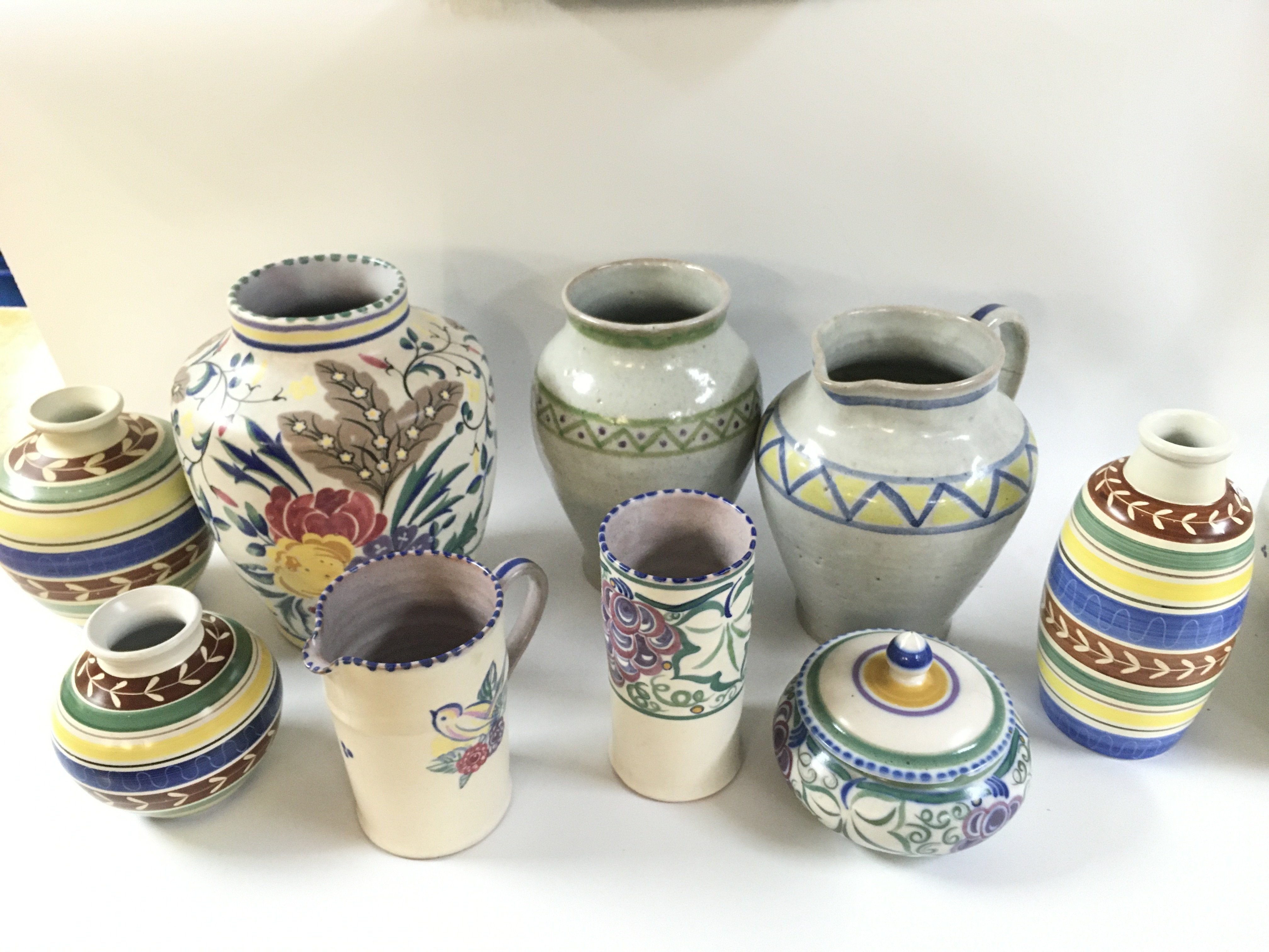 A collection of Poole Carter Stabler & Adams pottery including various vases, mug etc . This lot cannot be posted