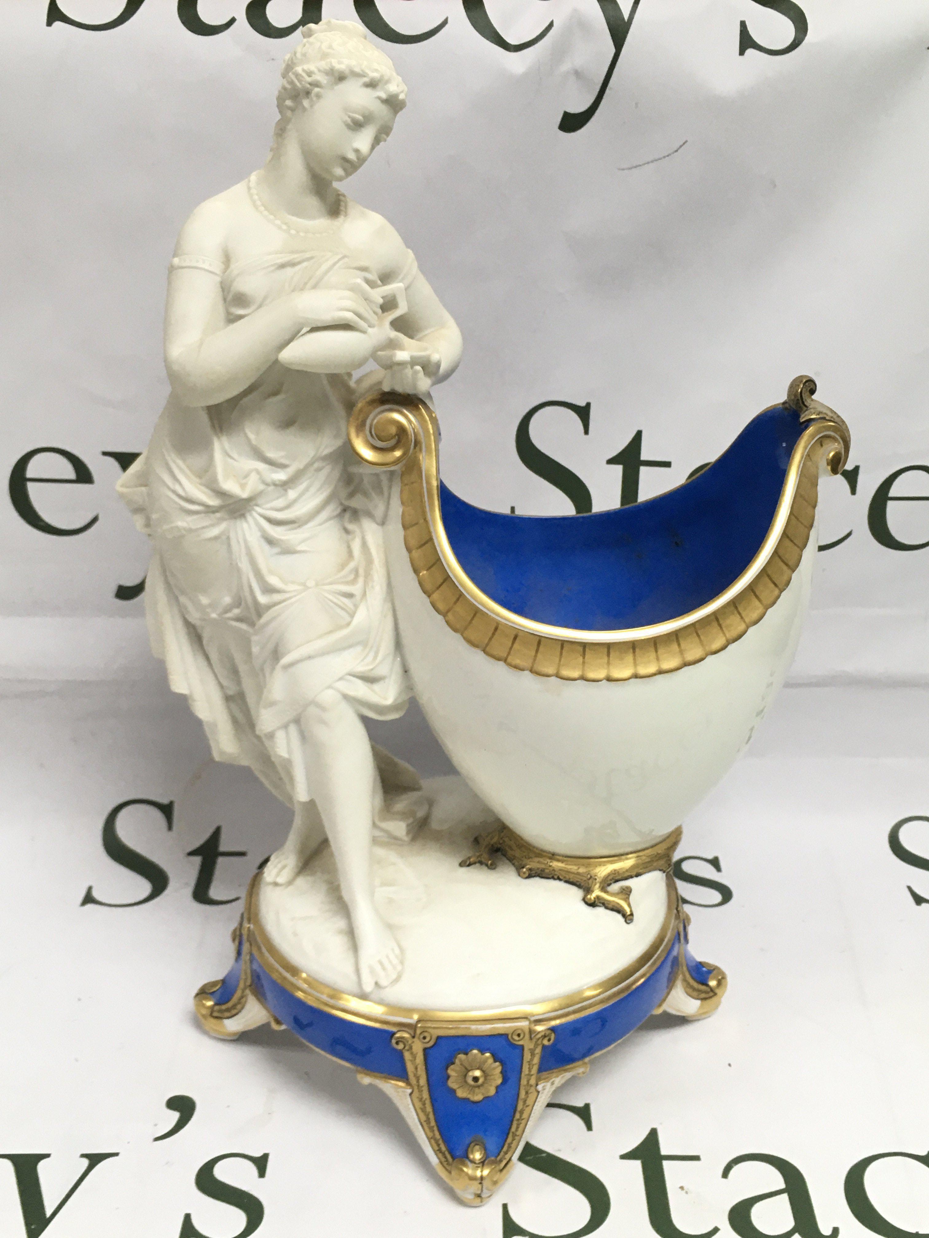 A Minton style figural vase, approx 36cm. Shipping category D.