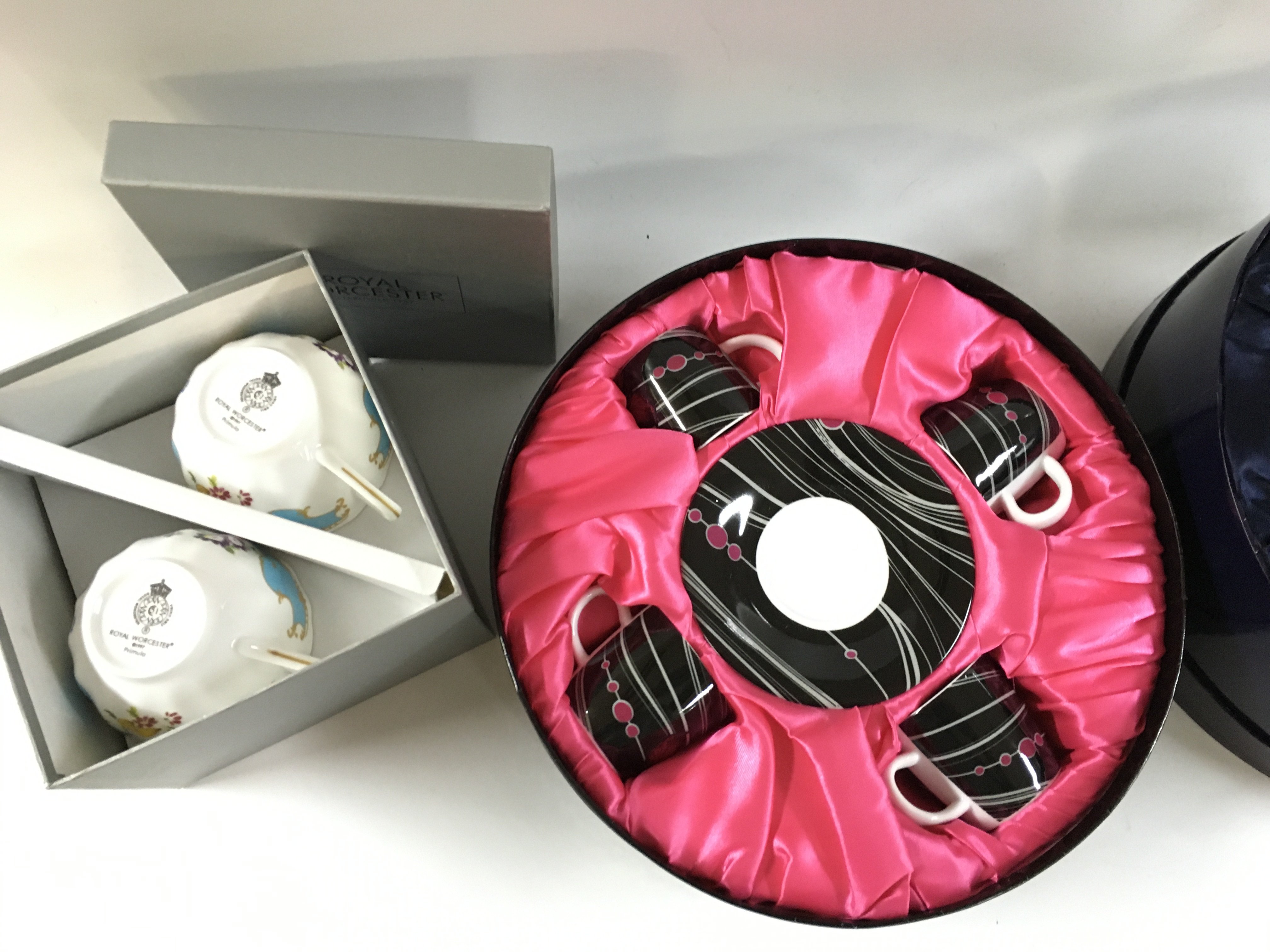 Five Boxed Royal Worcester tea cups including V&A pattern, Llewelyn bowen etc