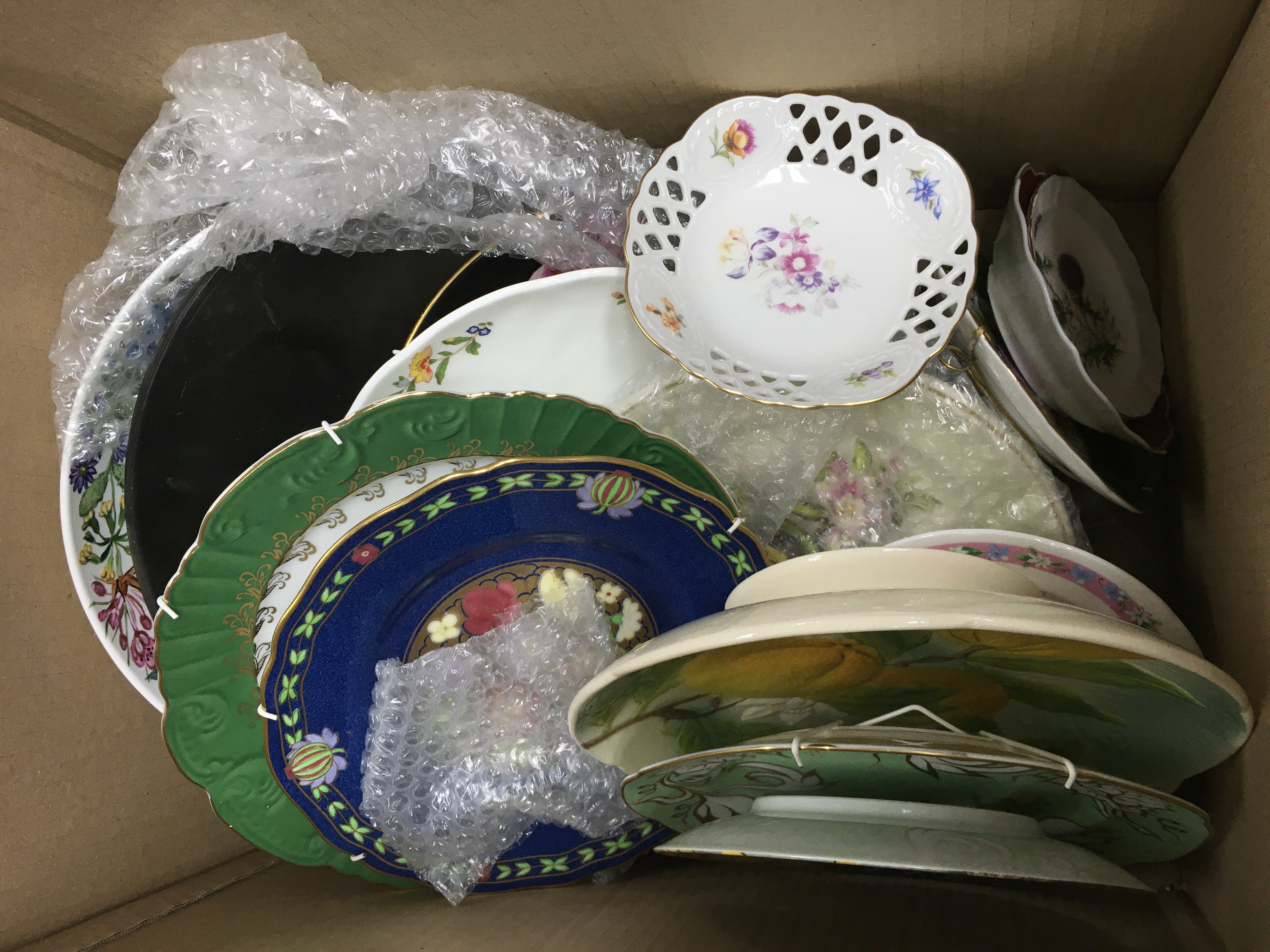 A box of ceramics comprising plates, vases etc. Shipping category D.