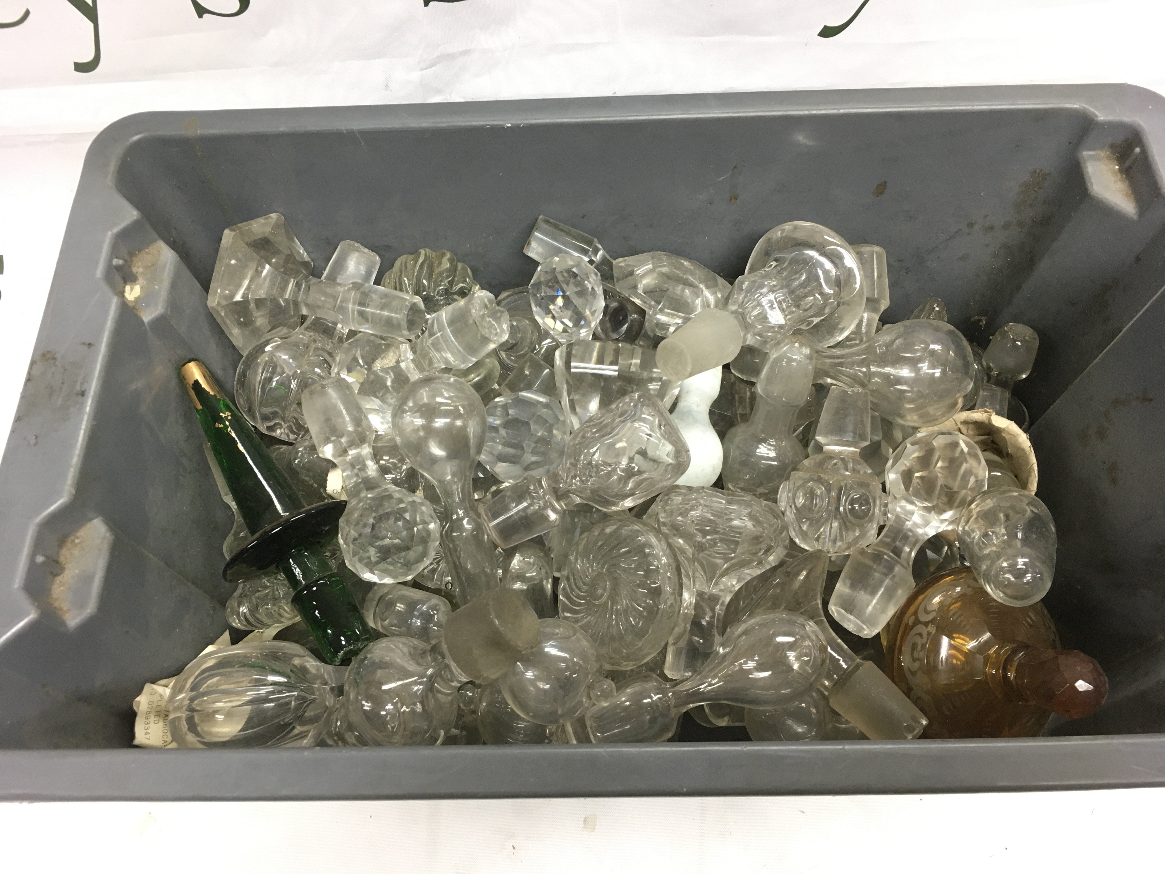 A box of glass stoppers. Shipping category D.