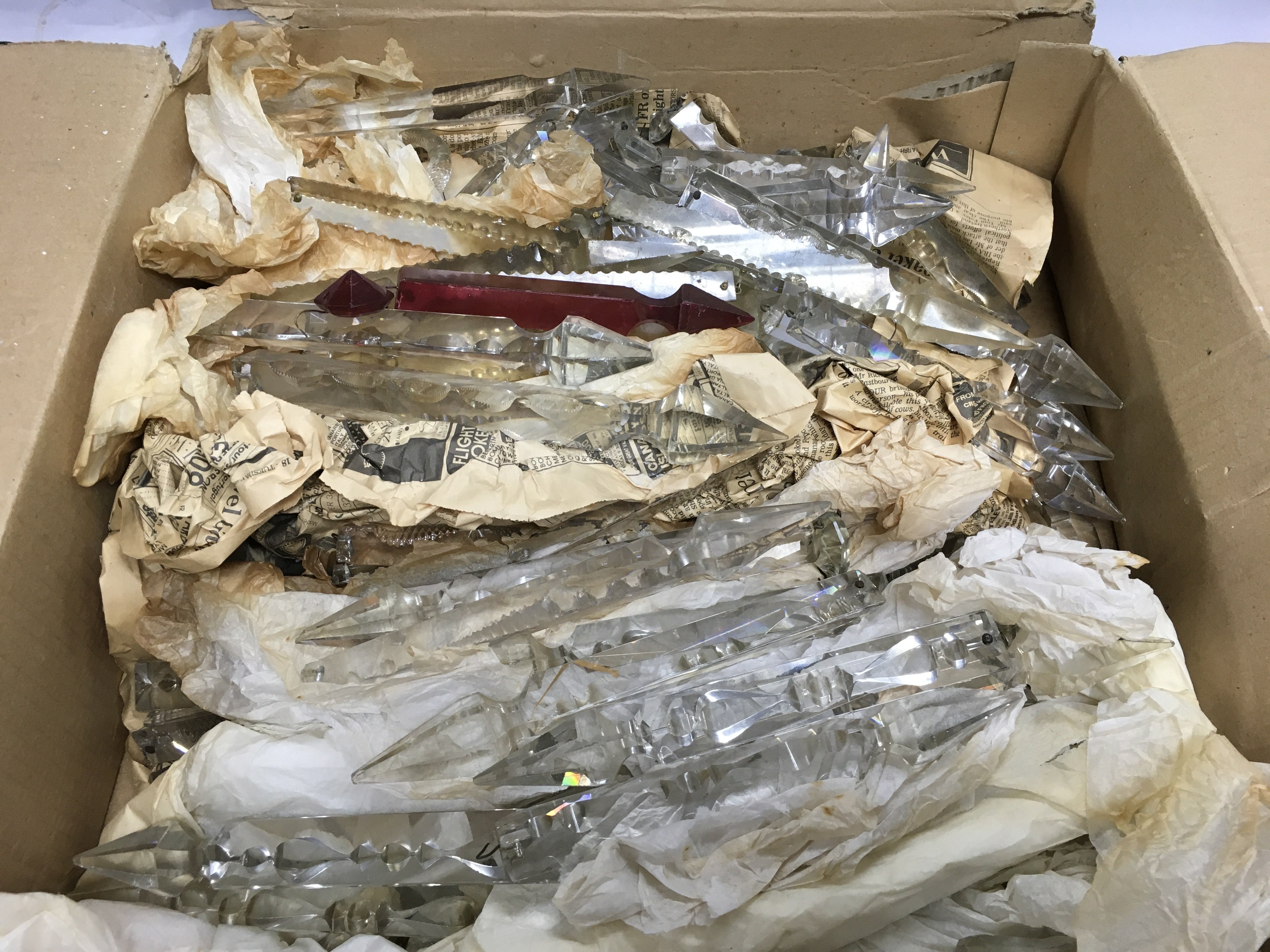 A box of cut glass lustre drops. Shipping category D.