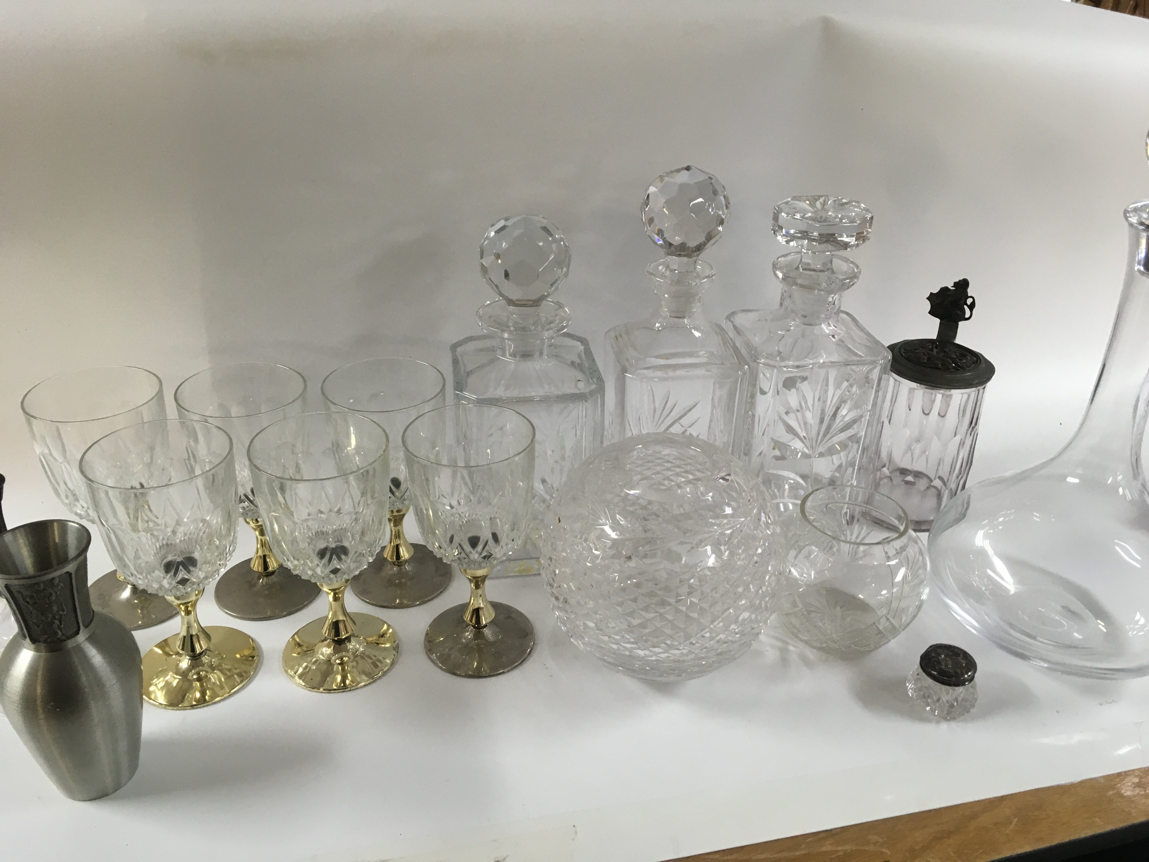 A collection of ceramics including green Wedgwood , cut glass decanters and glasses, vases, Springtime plates, botanic garden, Guernsey pottery dish , silver lidded condiment bottle etc.