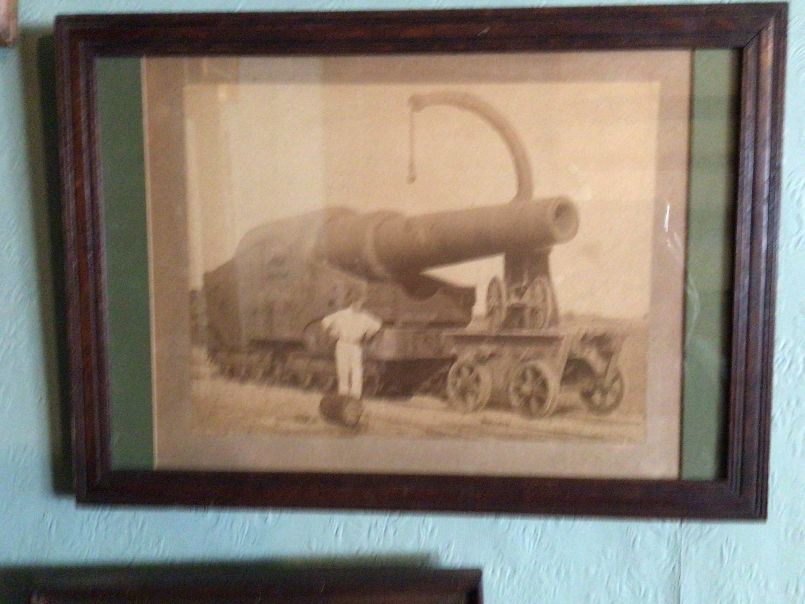 An intresting photograph of a late 19th century heavy cannon mounted on a Railway track a Marine photograph of an early steam ship and other antique photos and prints (10)