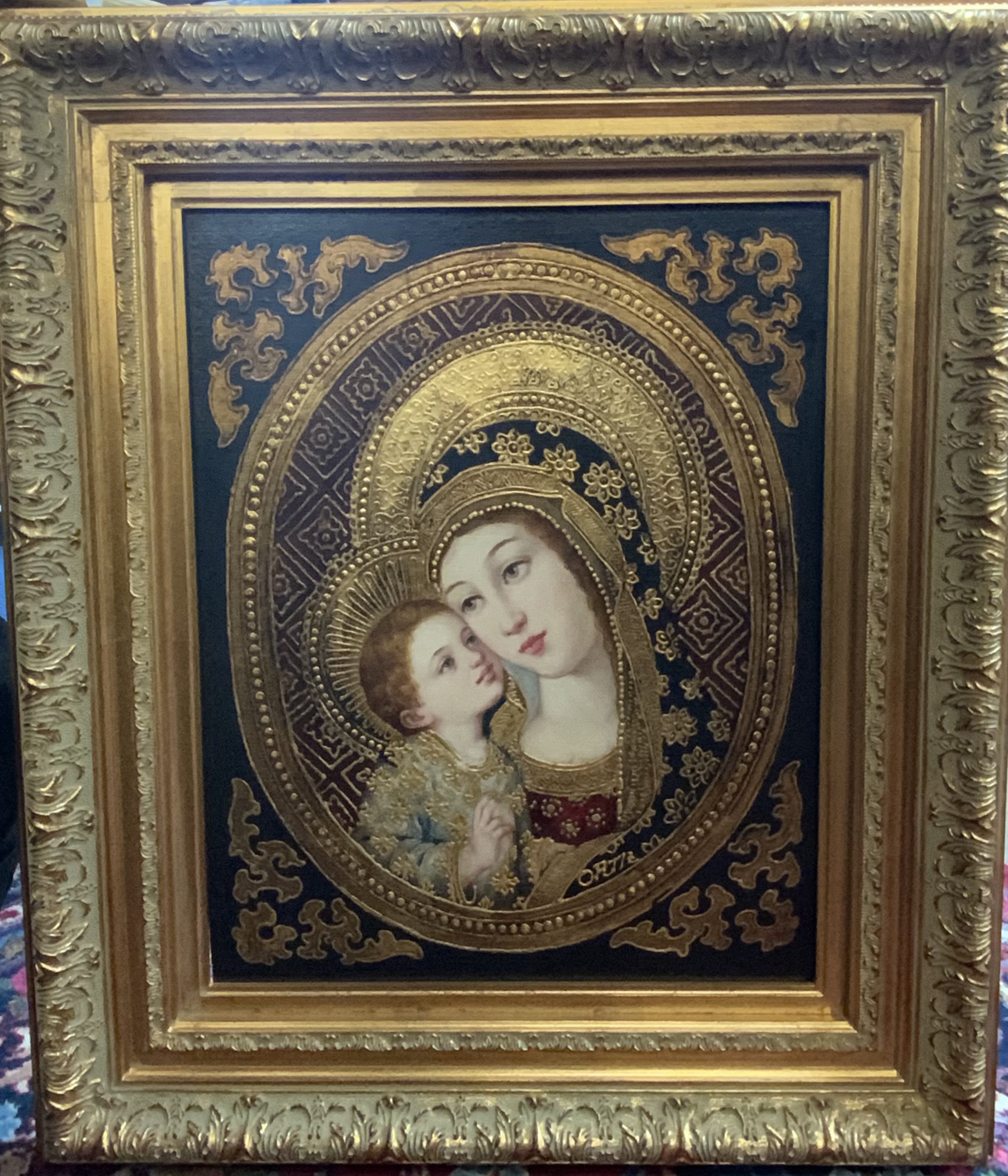 A gilt framed oil on canvas painting of The Madonna and Child. 73cm x 63cm.