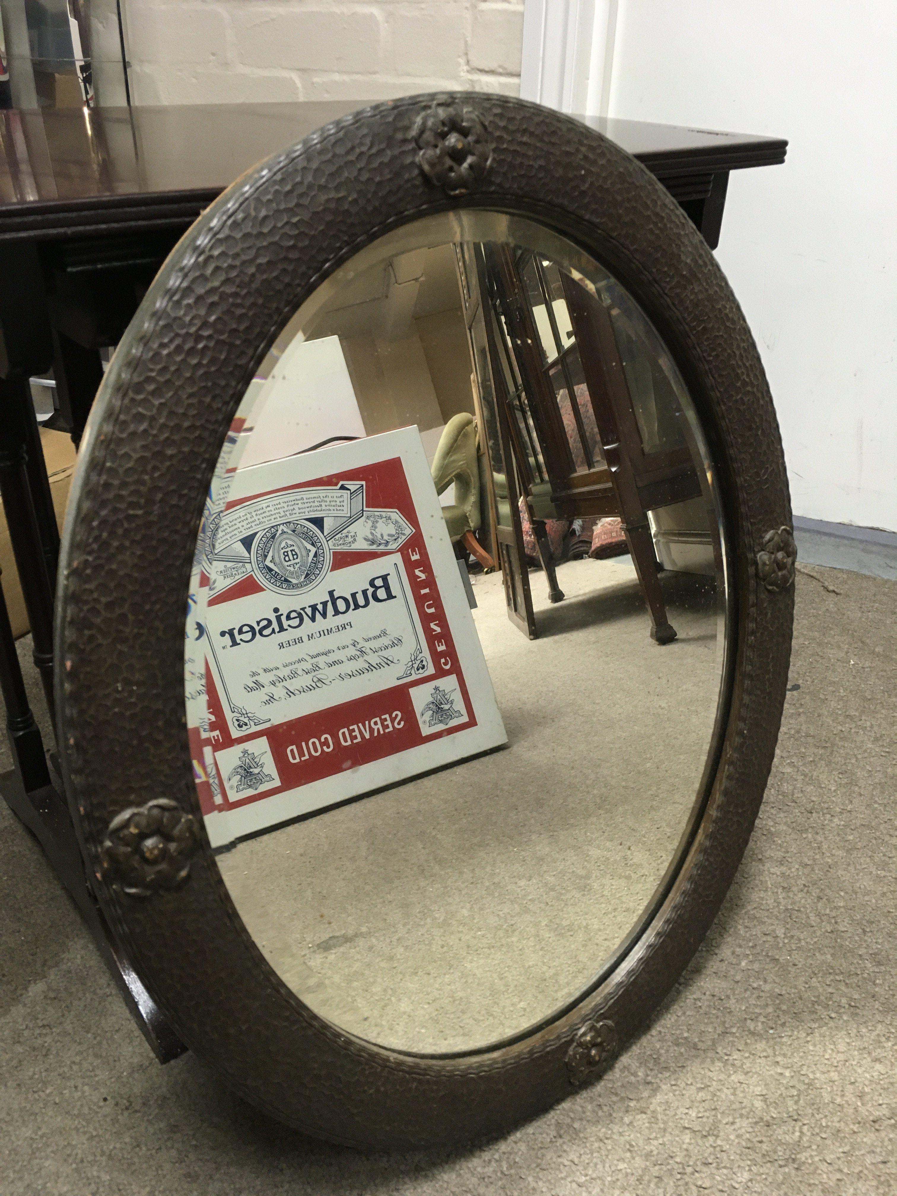 An oval oak framed wall mirror with a nest of mahogany tables. 54cm tall 52cm wide- NO RESERVE