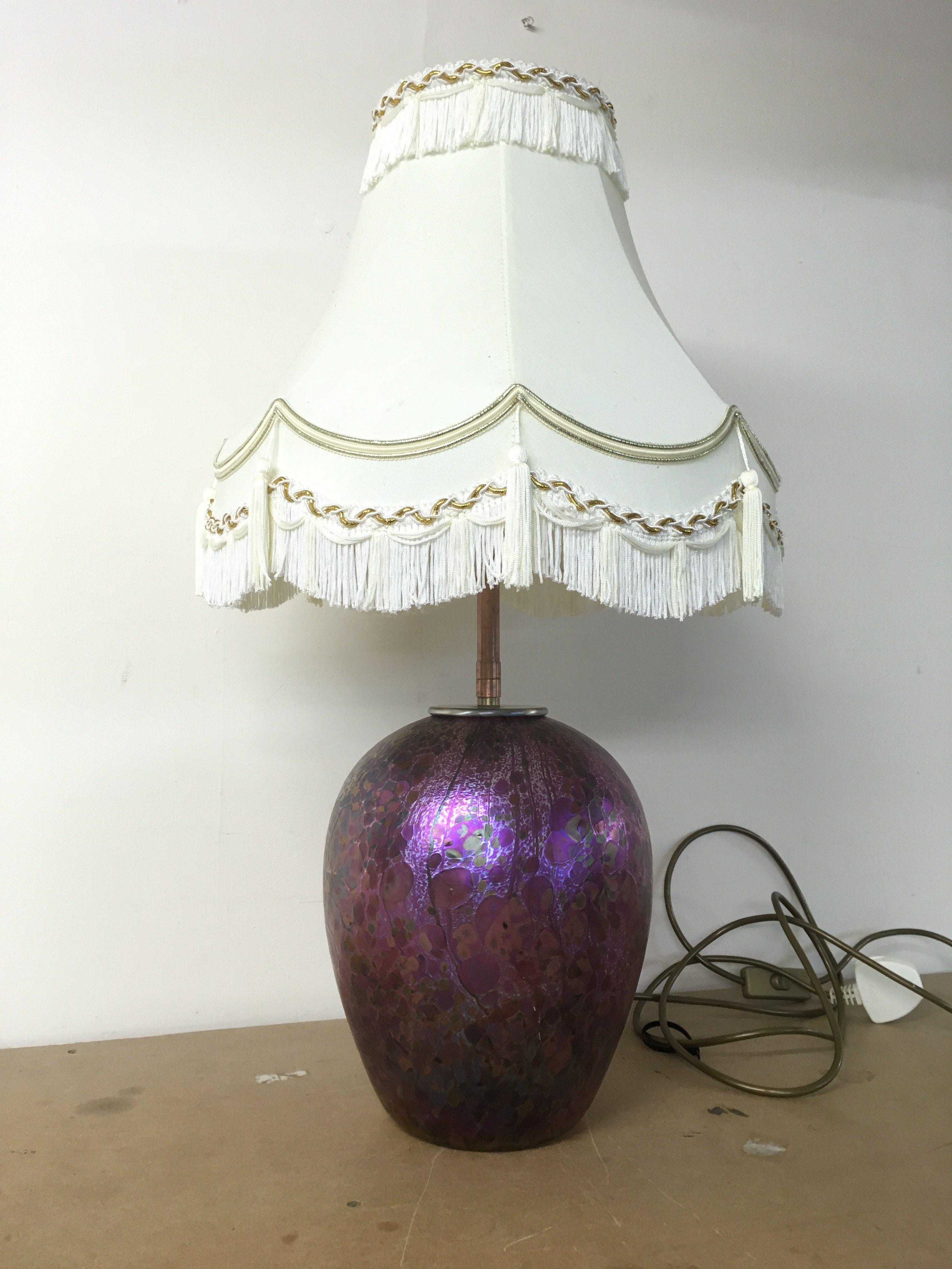 An Isle of Wight coloured glass lamp , with industrial fitment . Approximately 65cm tall