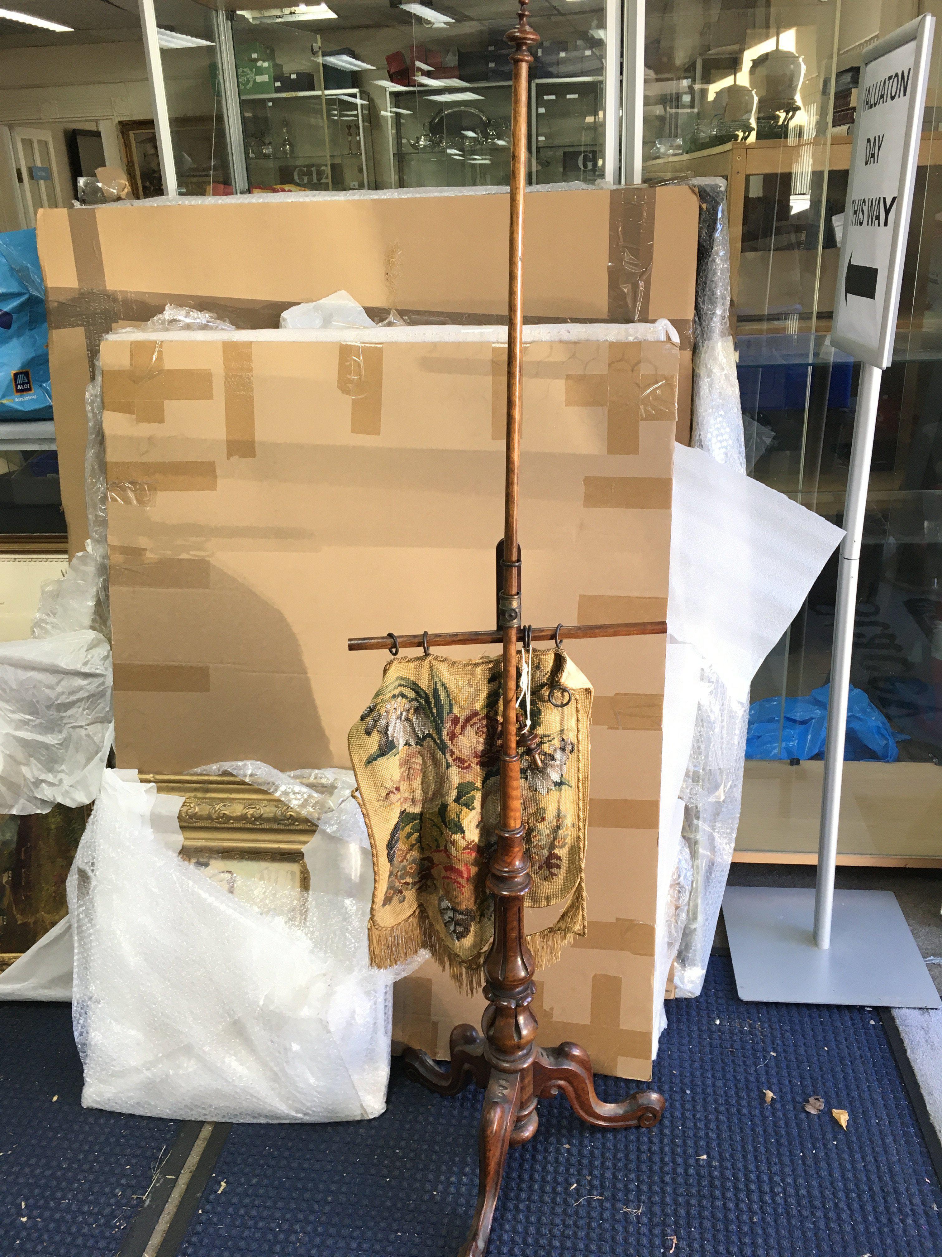 A mahogany fire screen. Shipping category D.