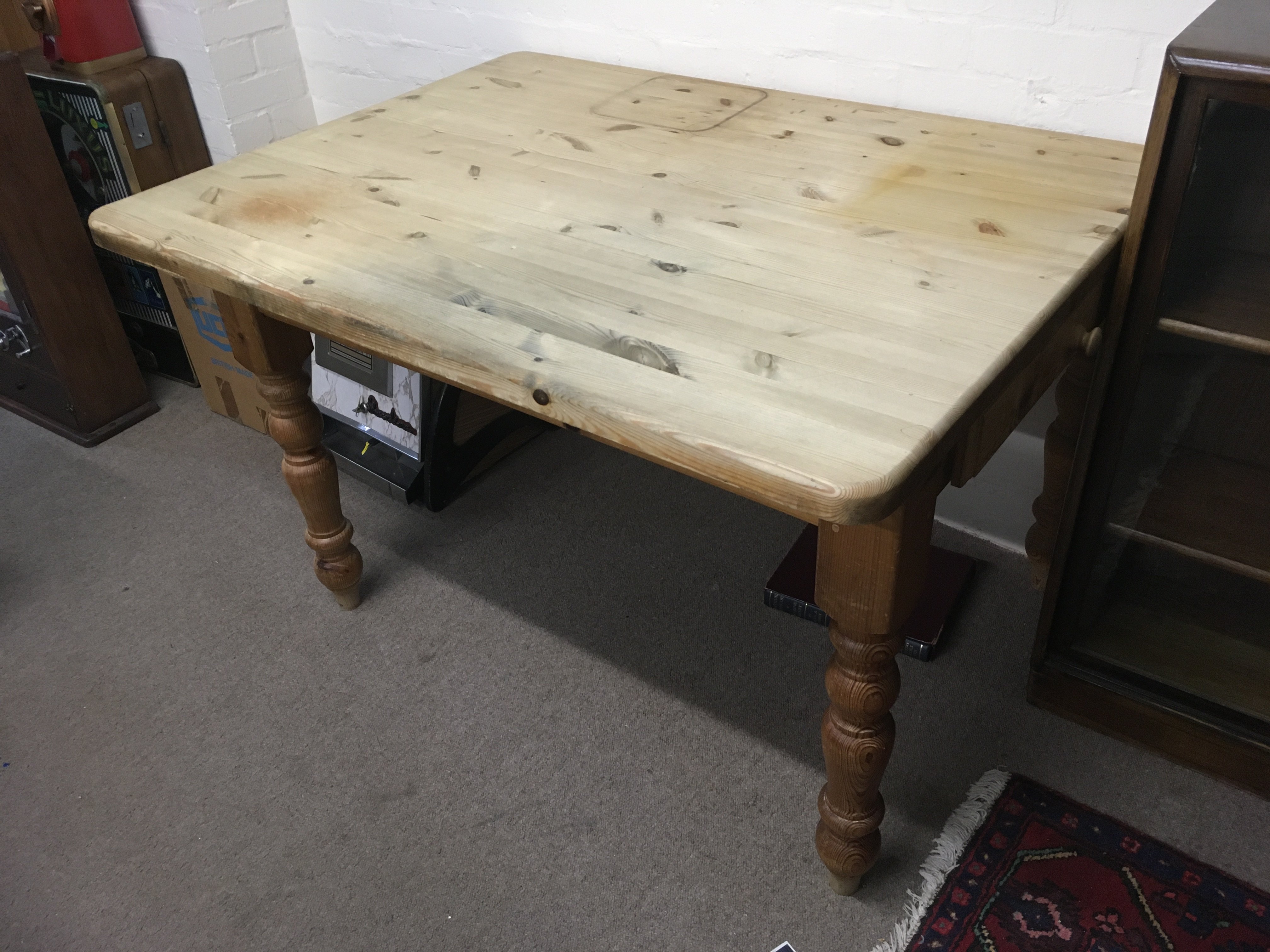 A pine kitchen table fitted with a drawer plus a pine dresser (2). Shipping category D.