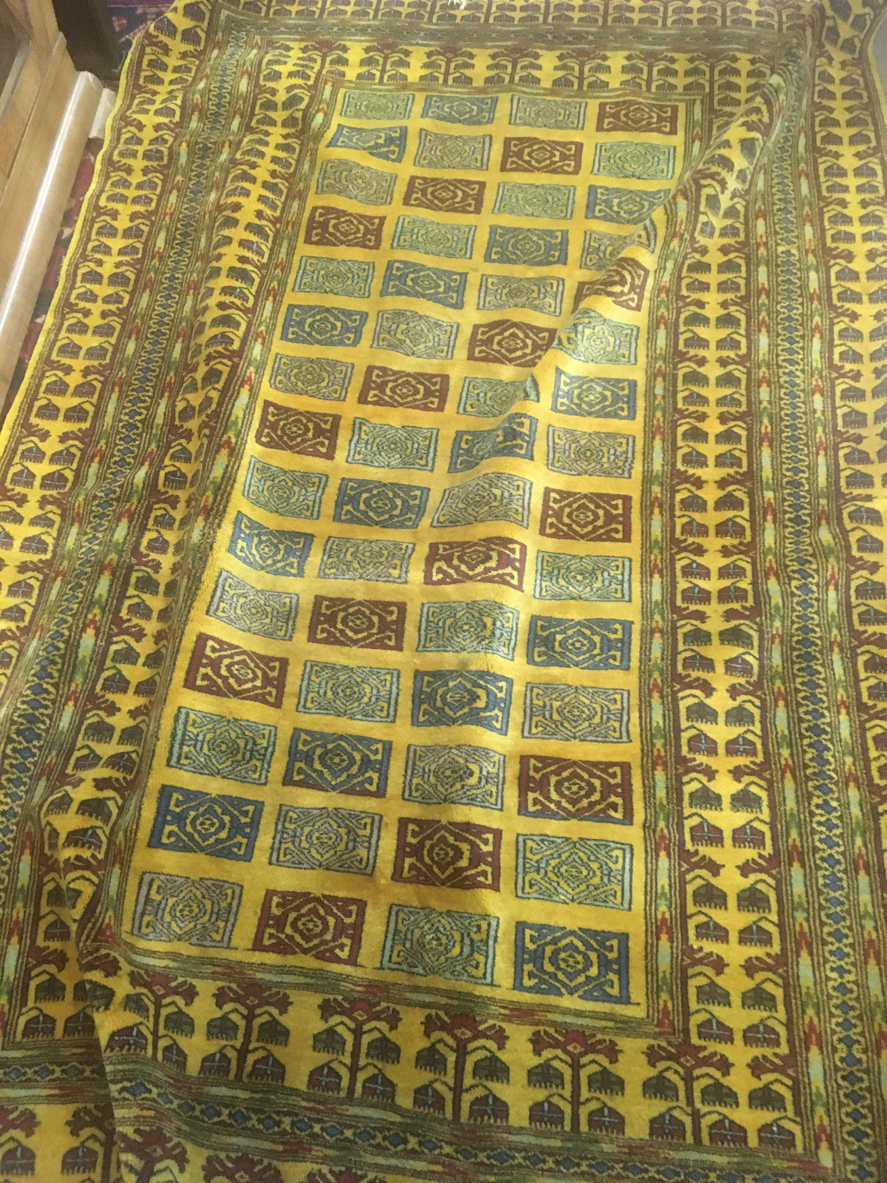 A killim rug the central field with geometric design and repeat pattern boarder . 180x 120 cm .