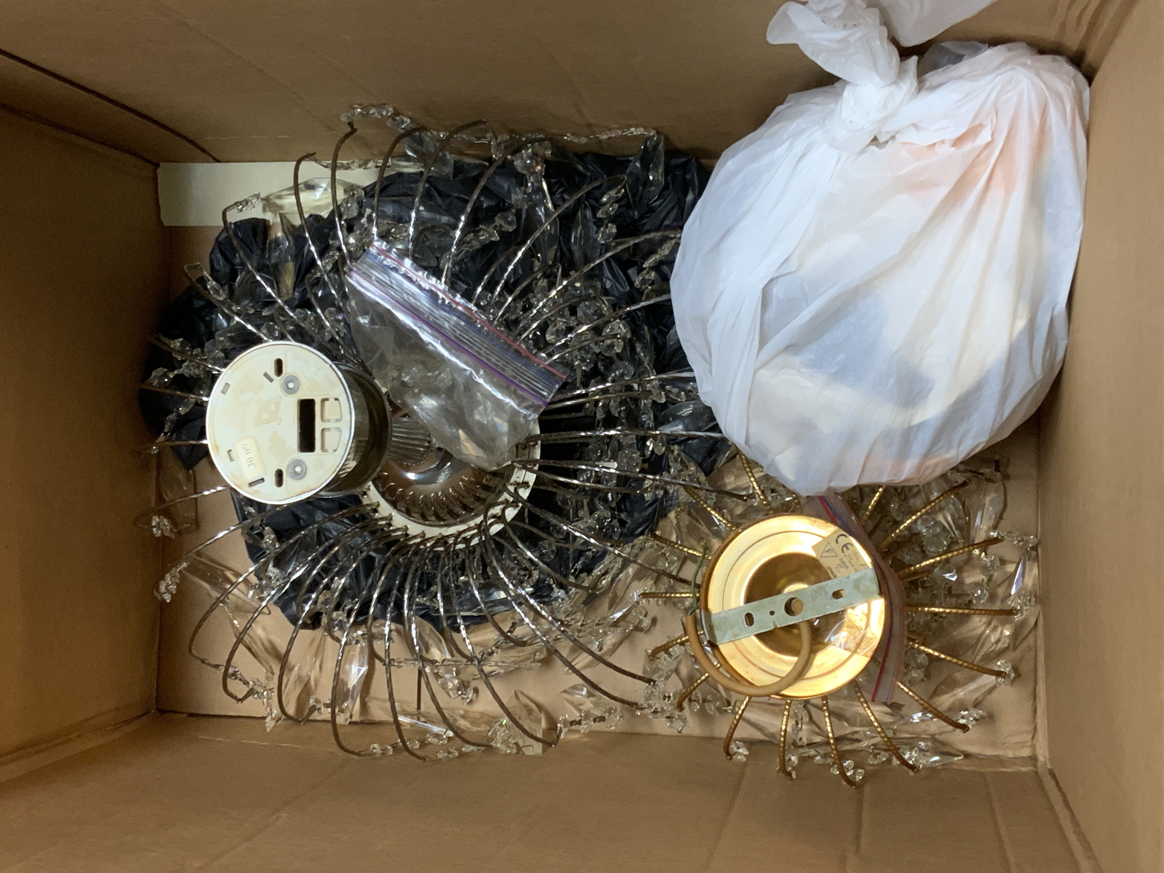 A chandelier style standard lamp together with 3 modern chandeliers.