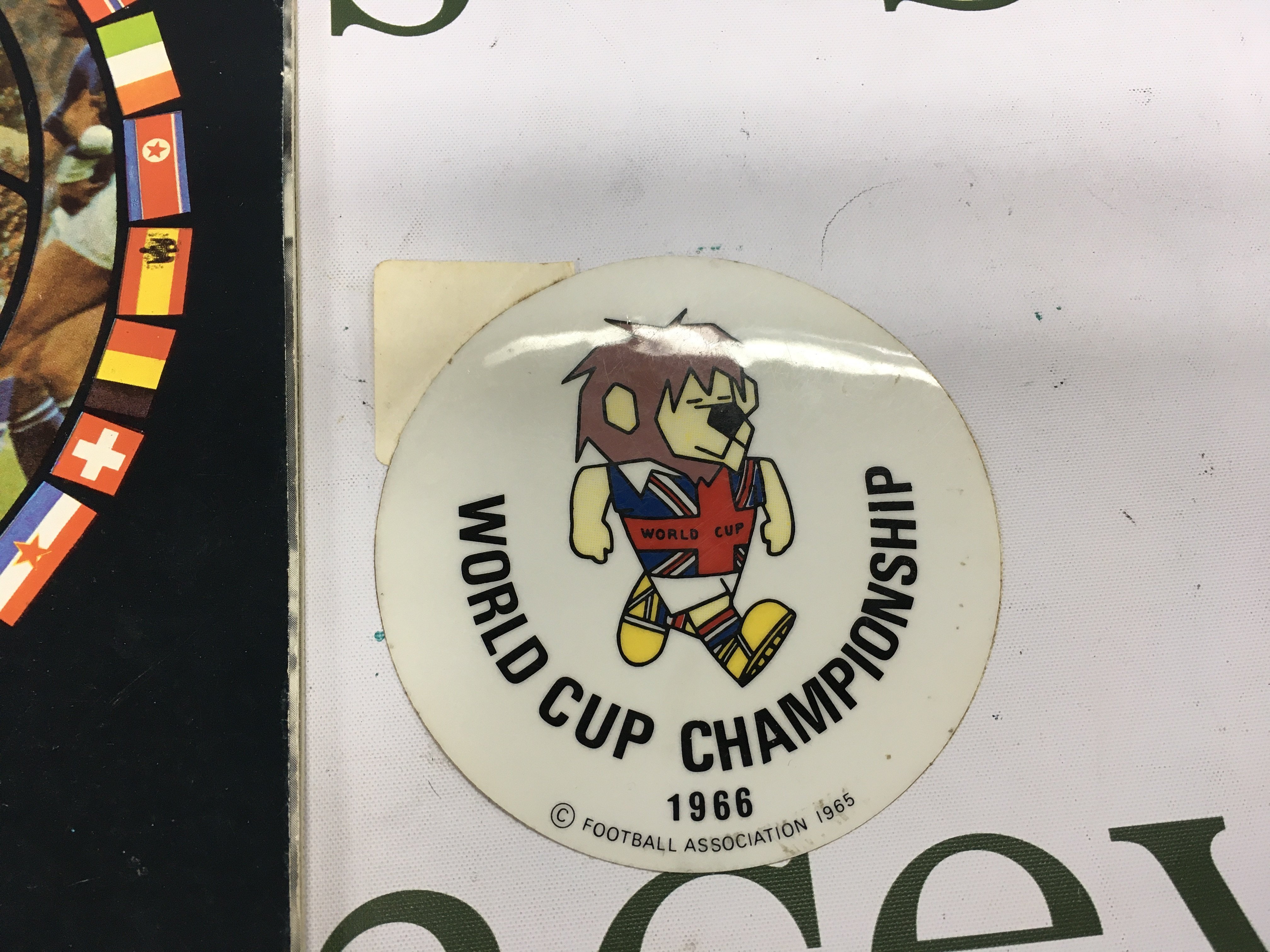 A 1966 World Cup Willy car sticker and a football monthly World Cup 1966 souvenir magazine in good condition.- NO RESERVE