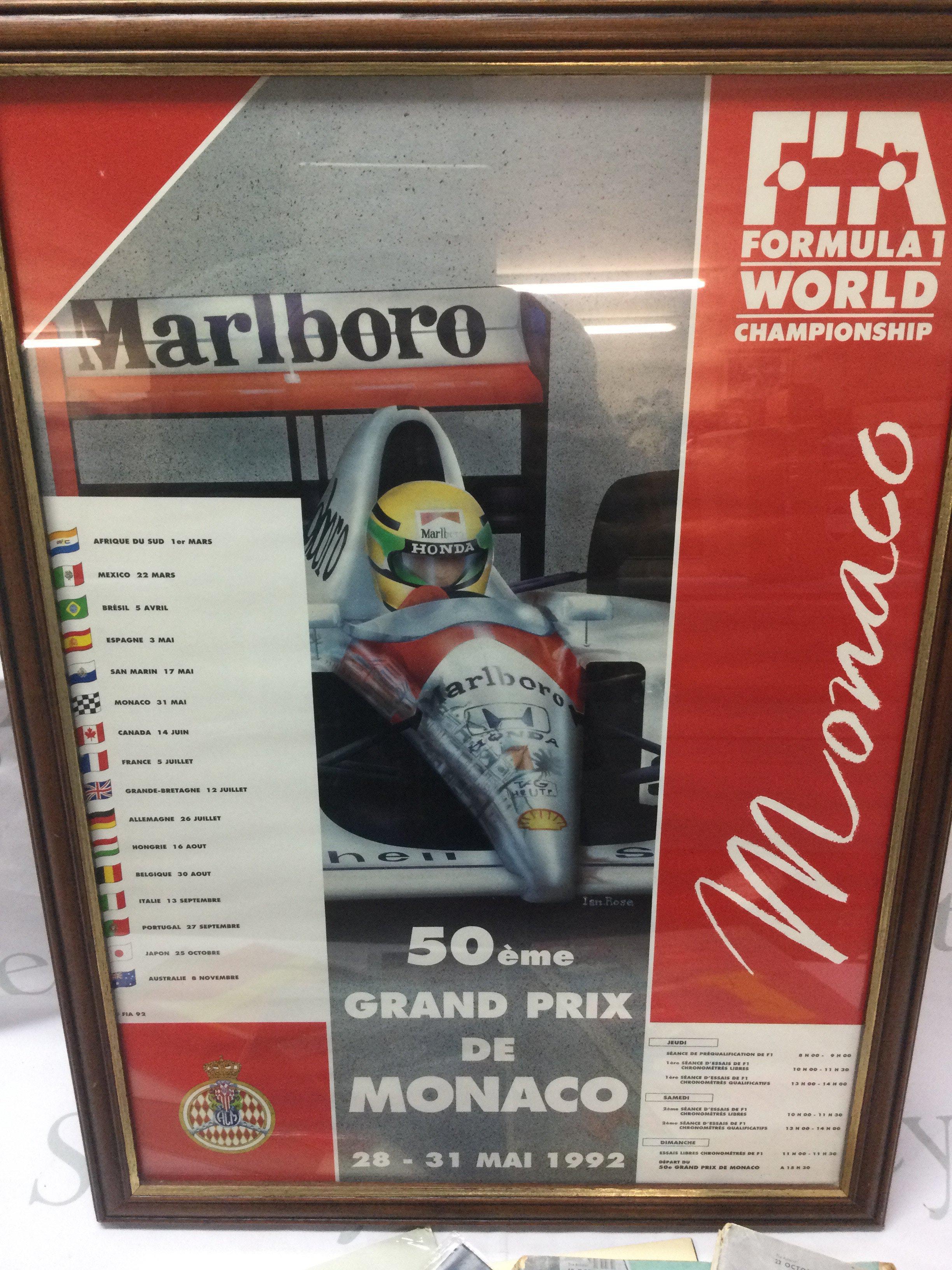 A collection of vintage motoring items including a framed Formula 1 Monaco 1992 poster ( frame dimensions 47x65cm )The Autocar London show reports 1957 & 1959, Rootes Motors Humber Super Snipe poster and brochure, Ford Zephyr 4 advertising brochure, Ford Zodiac advertising brochure, Cadillac 1971 & 1979 catalogues. Postage category B without the glass frame.- NO RESERVE