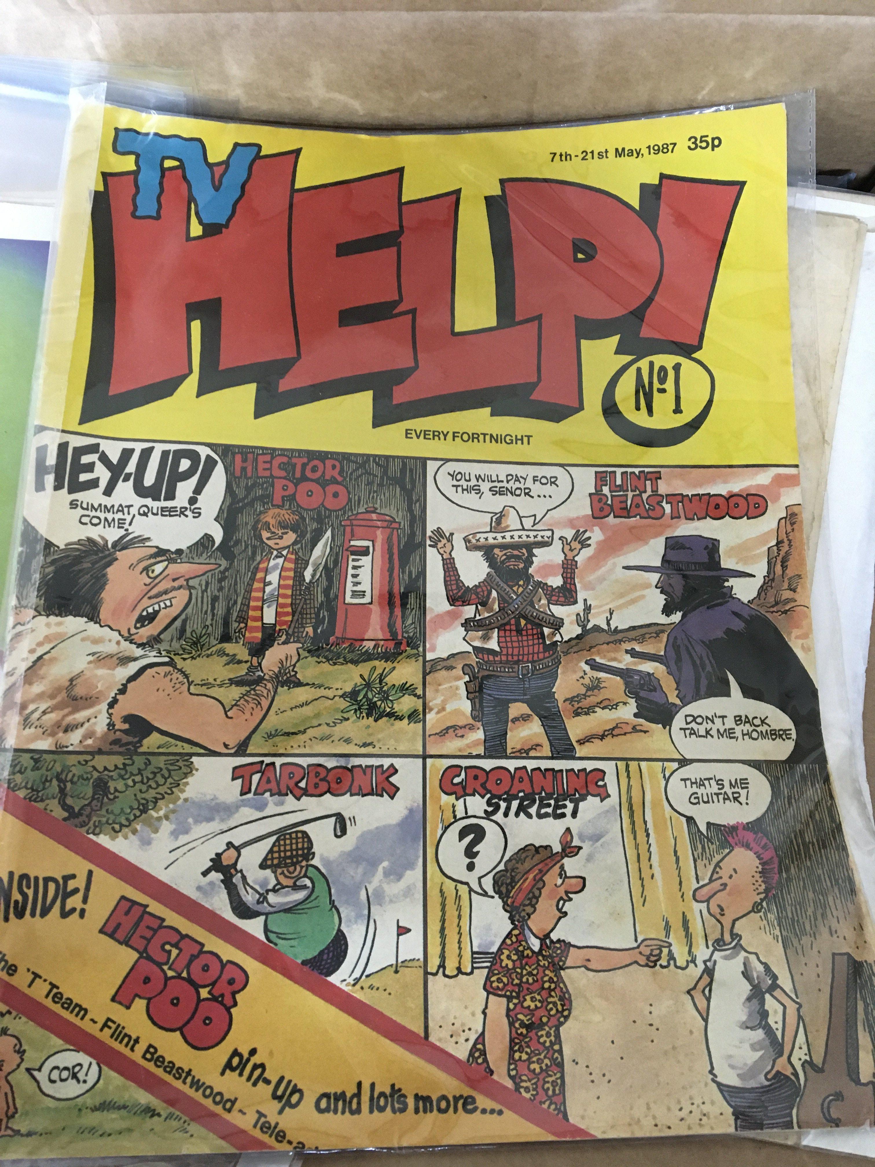A box containing ephemera including some first issue comics TV Help issue one Vintage Topical Times football players Vintage Champion and lots of other ephemera.- NO RESERVE