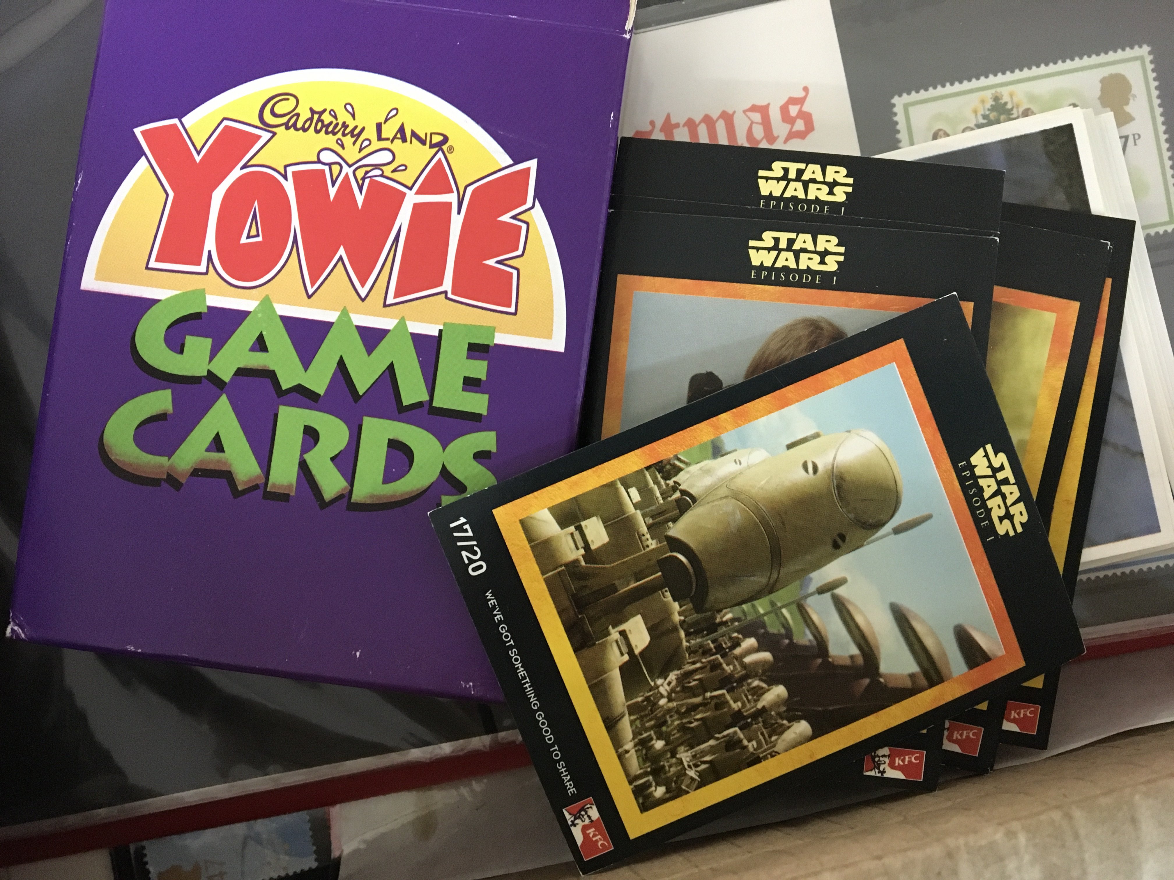 A box containing some presentation packs first day covers vintage playing cards and other ephemera.- NO RESERVE