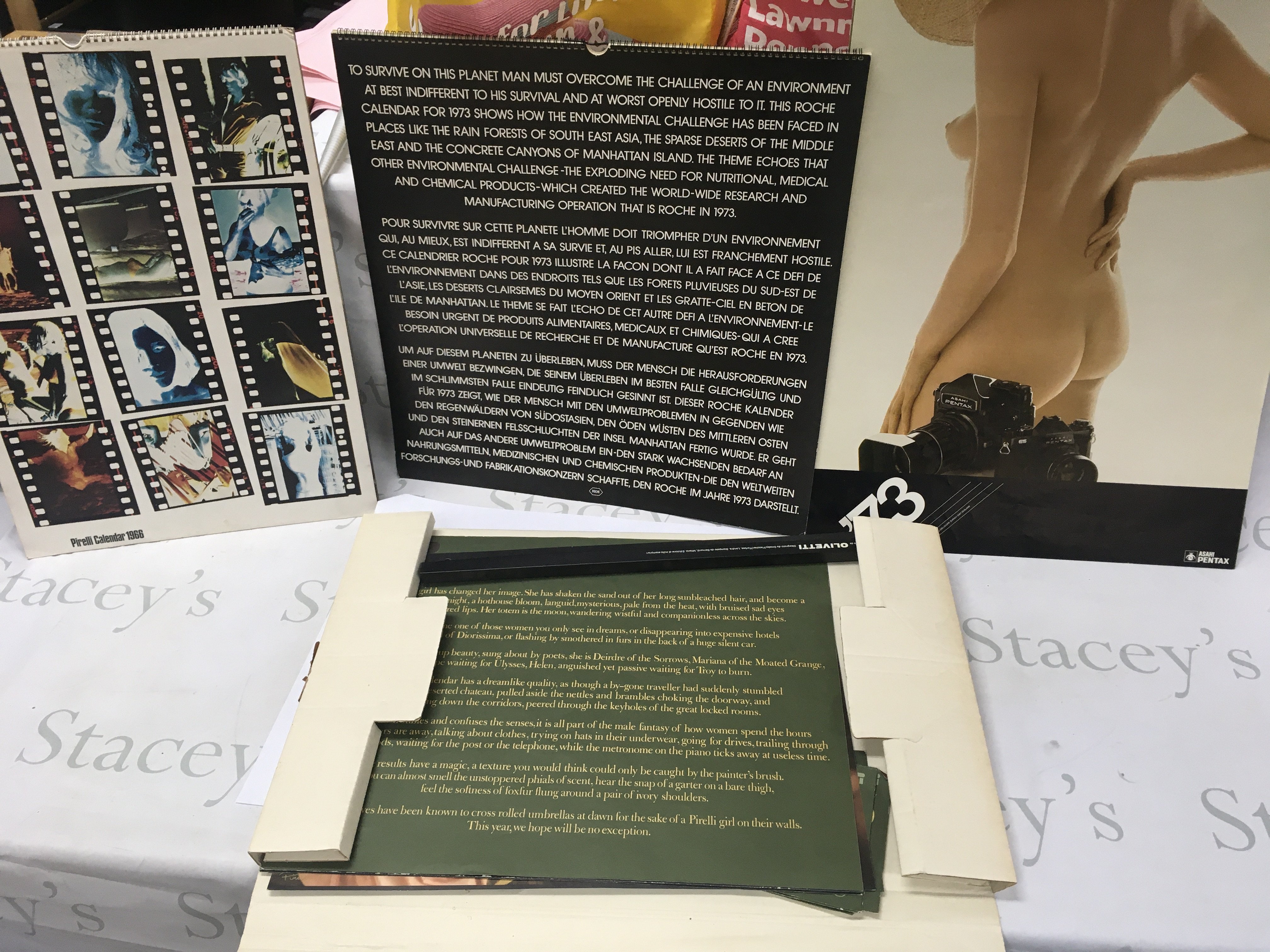 A 1966 Pirelli calendar a 1973 Asahi Pentax calendar and two others.