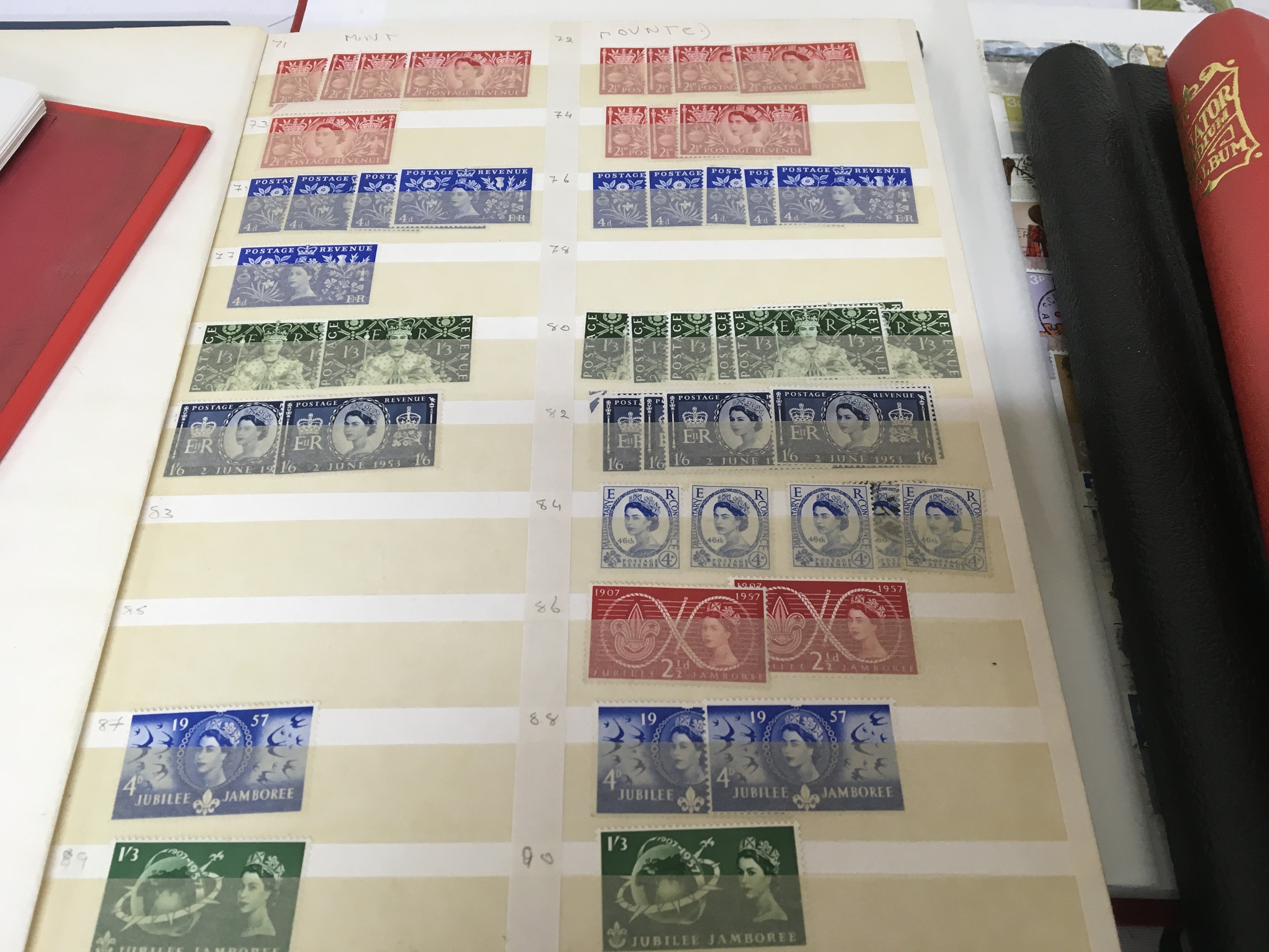 A collection of four albums of stamps including an album of unused Elizabeth II pre decimal stamps an album of Mint unused Channel Island stamps and two albums of British Pictorial stamps (4)