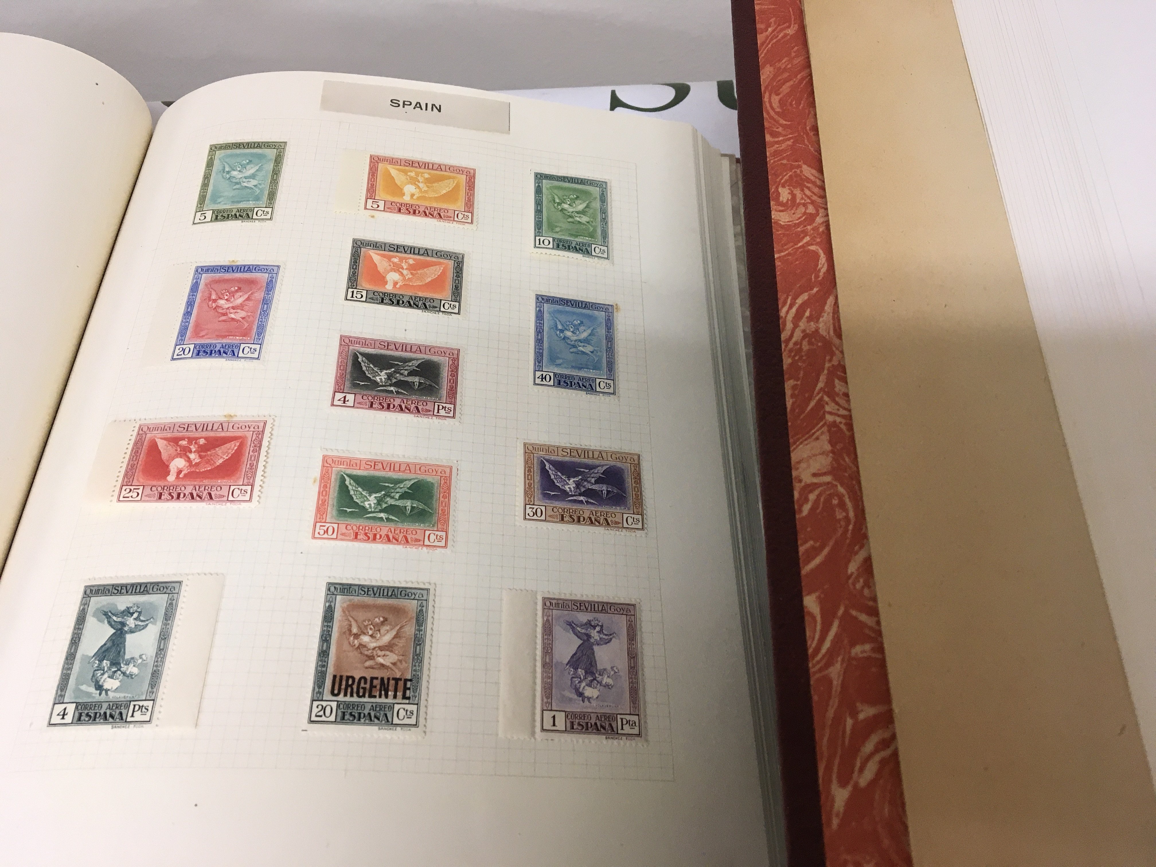A Box containing Six albums of stamps including American stamps two albums of QEII stamps unmounted mint and other world stamps