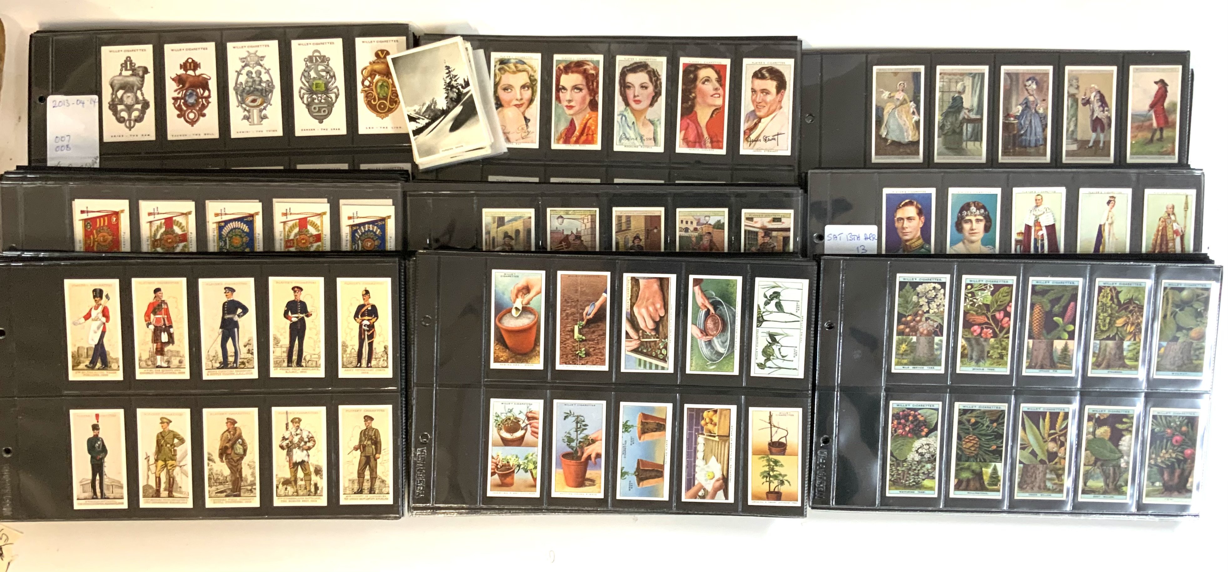 A large collection of cigarette cards, including Wills/Players etc.