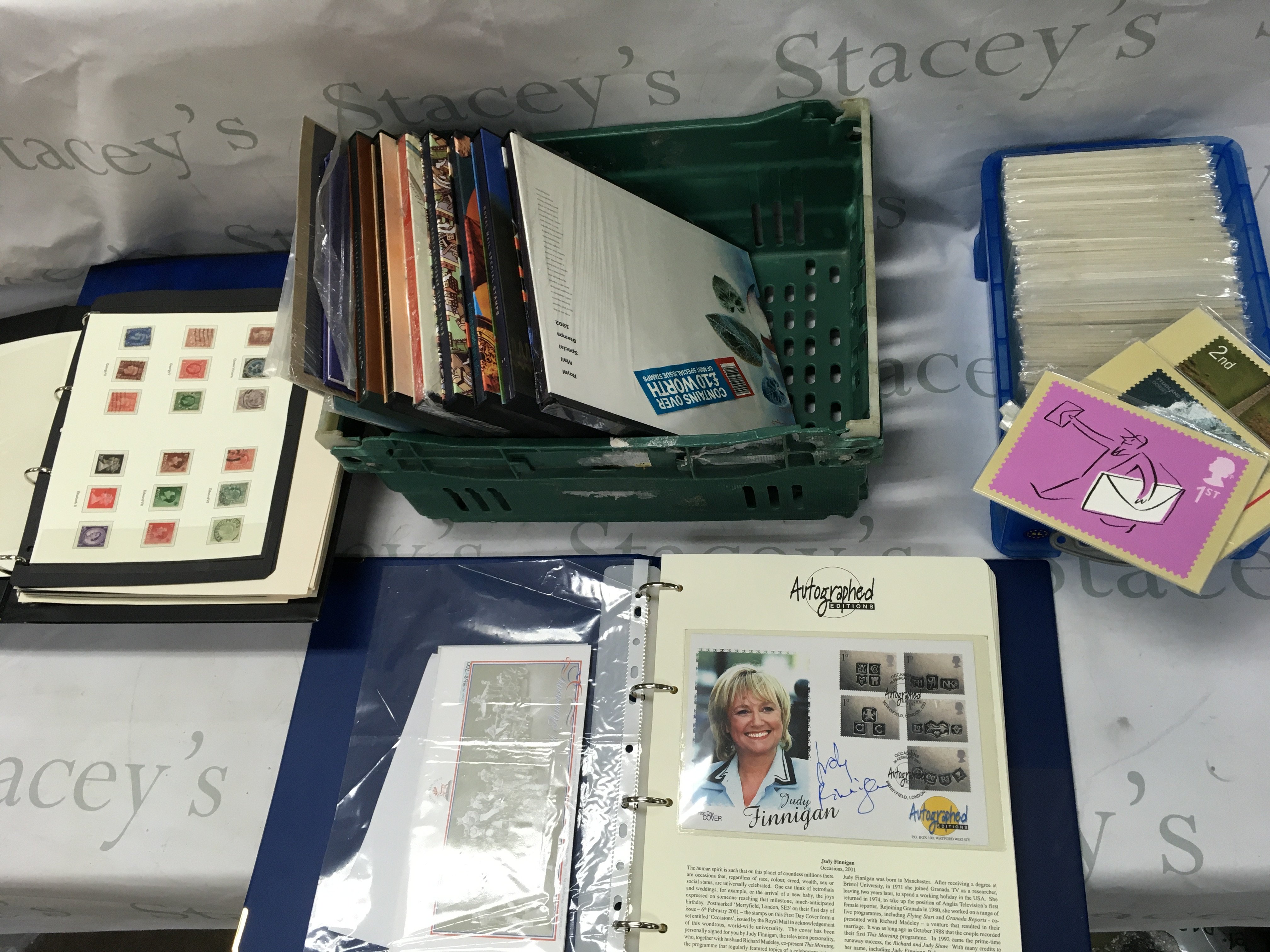 A box of Royal Mail year books with stamps along with stamp album signed covers etc